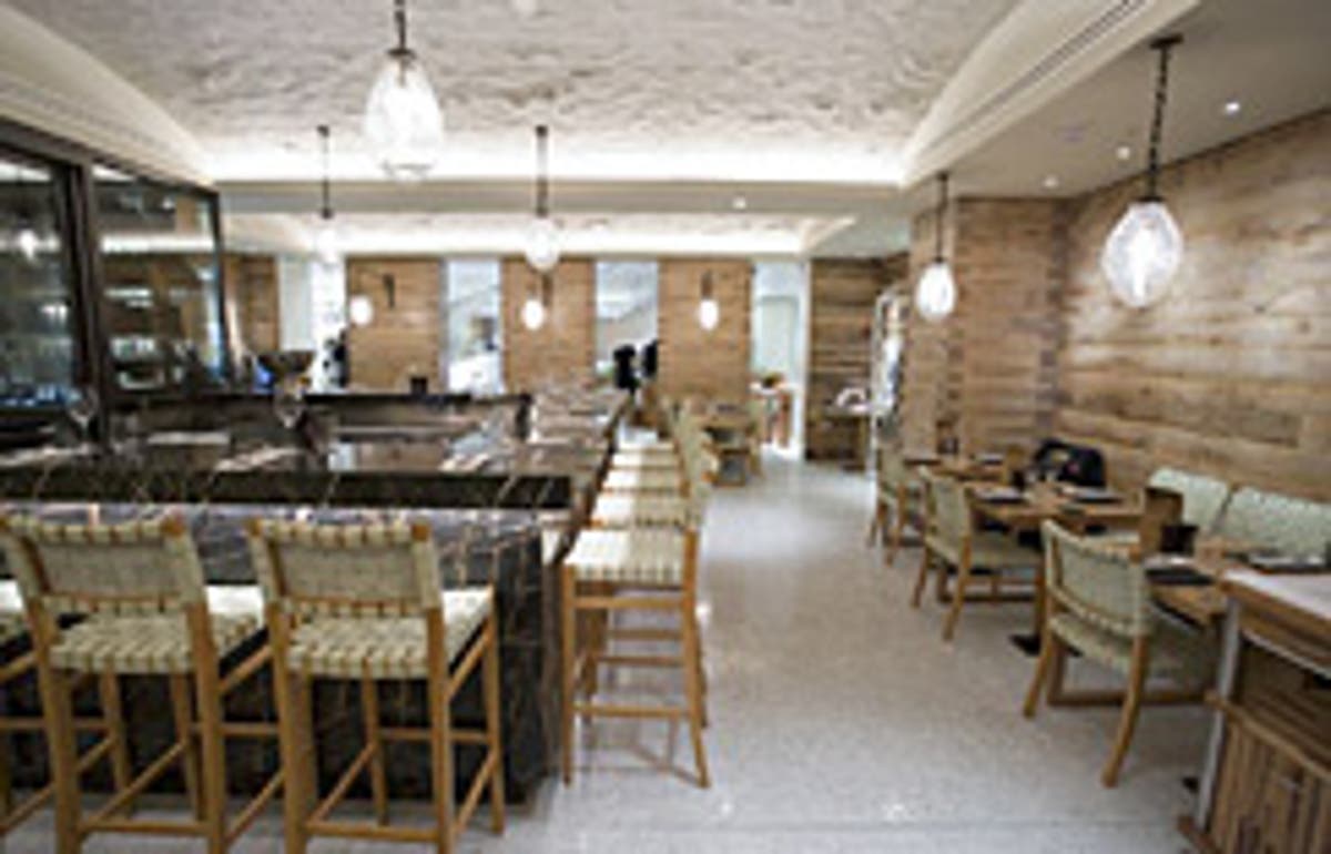 Modern Wine Bar at Fortnum & Mason, warm wood accents, ideal for cocktail receptions.