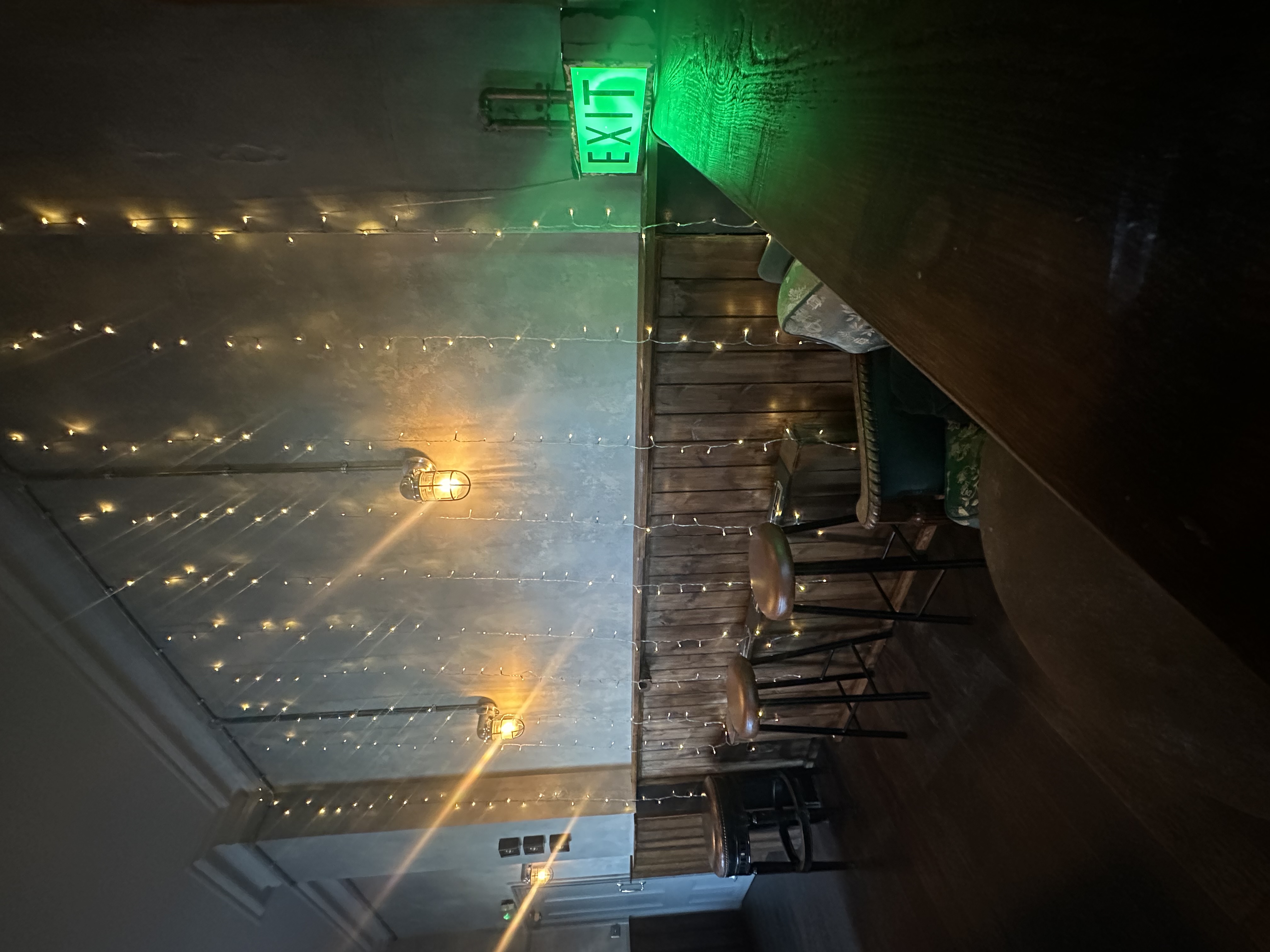 Cozy billiard room with warm lighting, perfect for intimate gatherings and events.