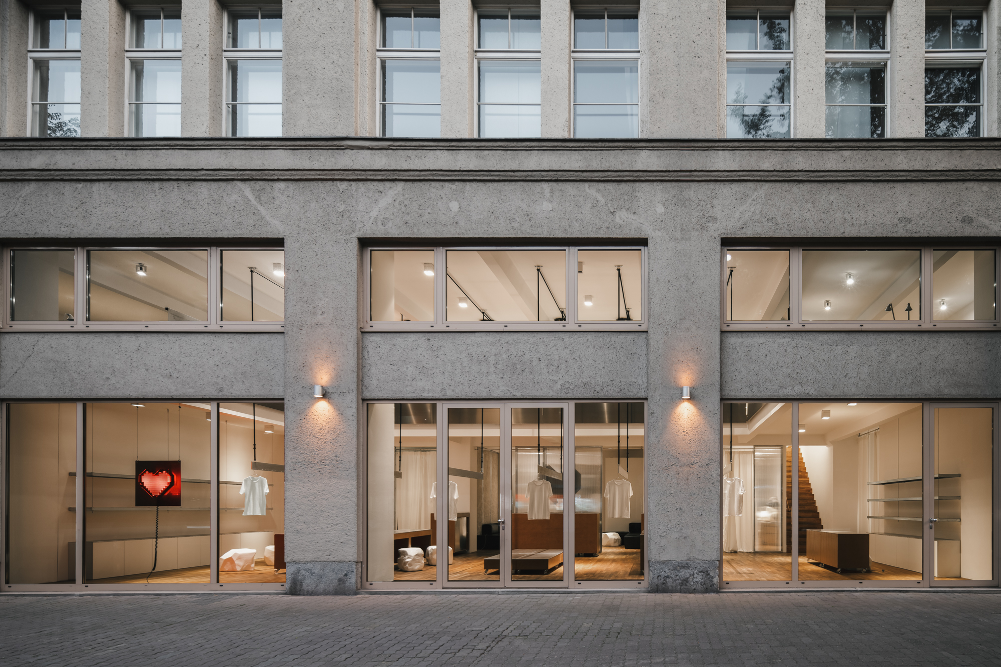 Modern venue with large glass windows, perfect for corporate meetings and social events.