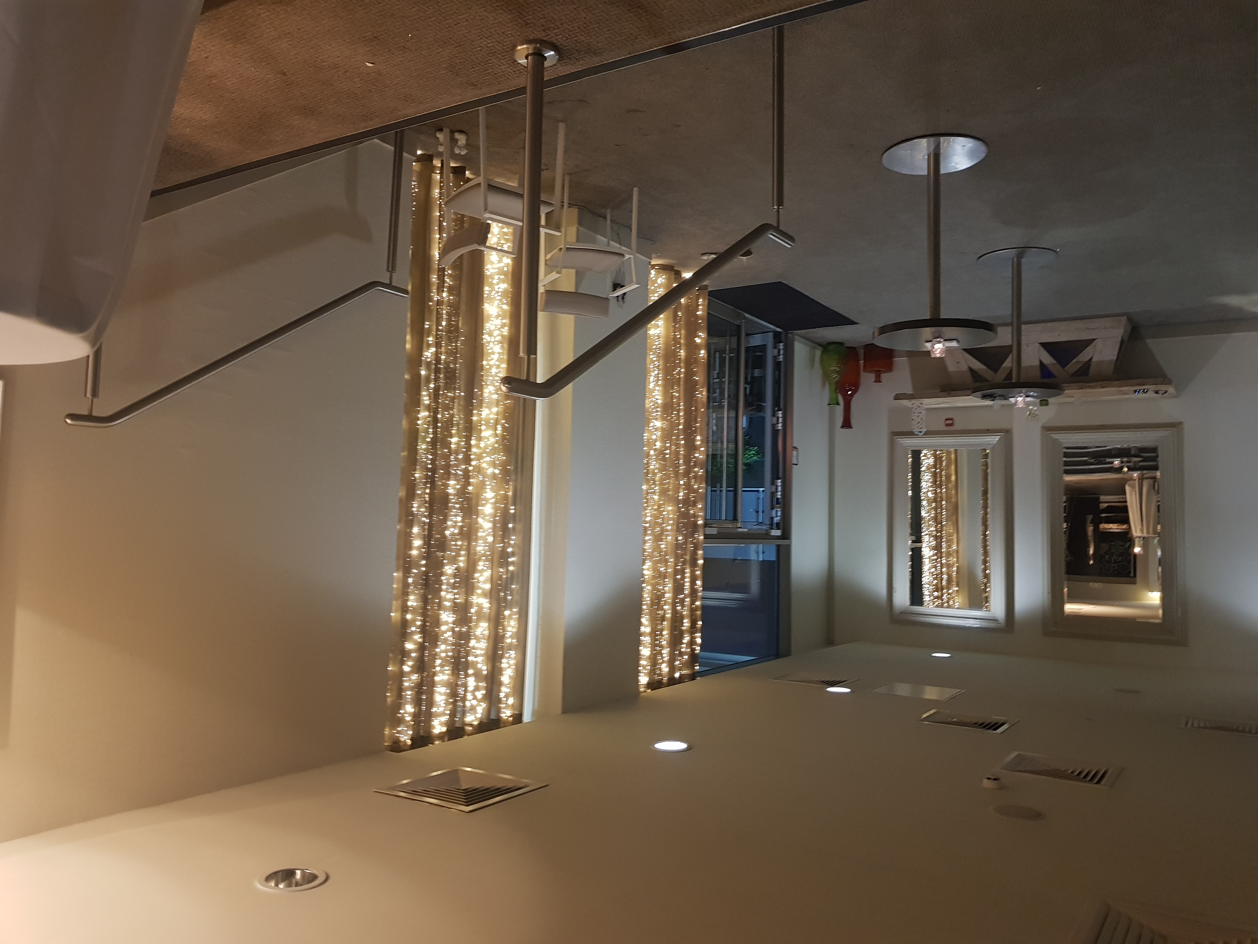 Elegant event entrance with soft lighting, perfect for networking and cocktail receptions.