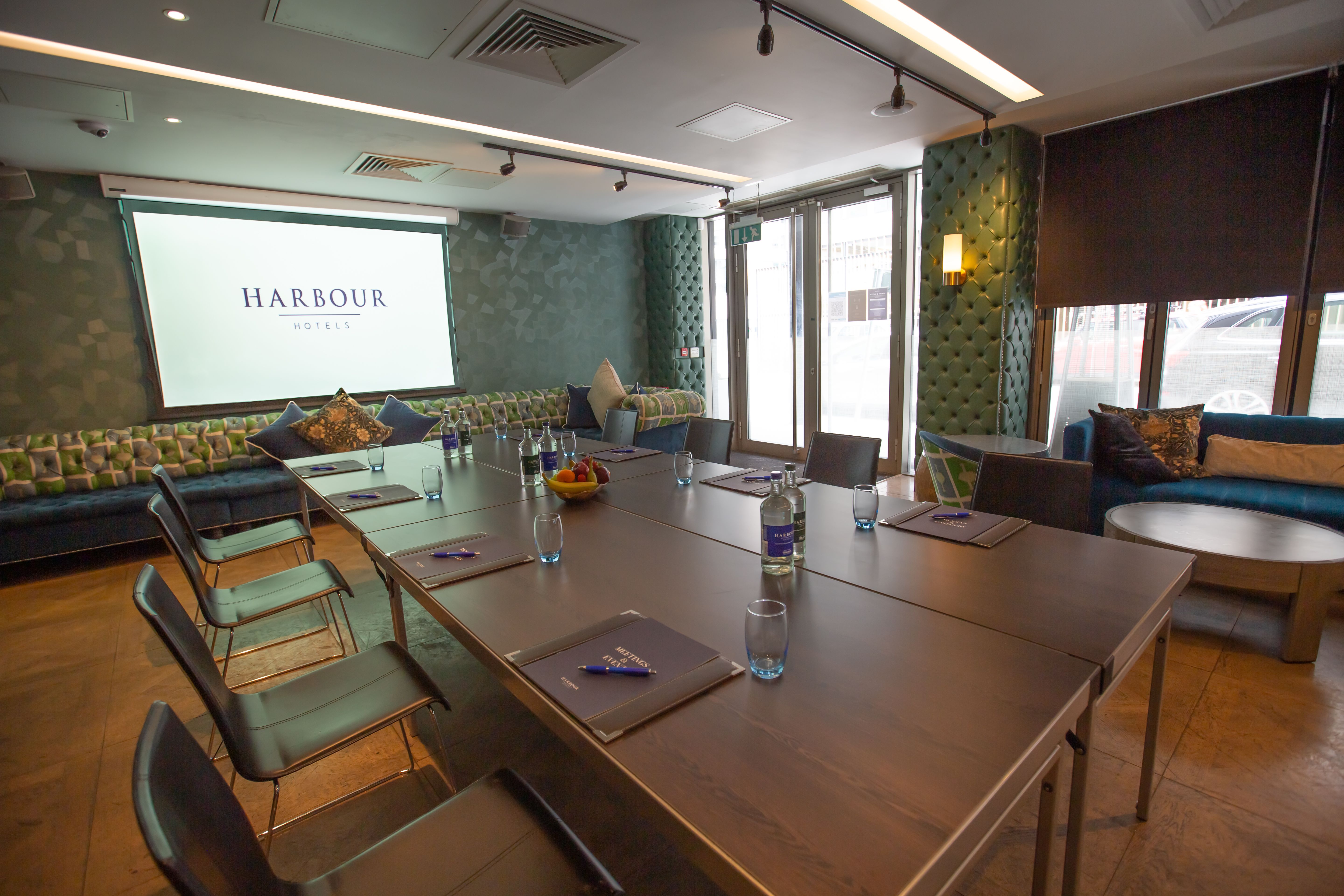 Long Bar Late meeting room with stylish seating, perfect for corporate workshops.