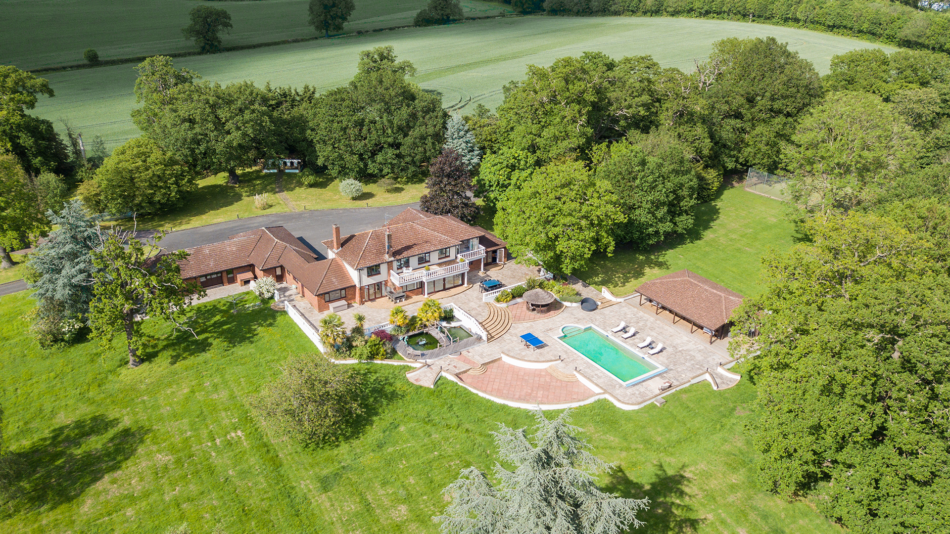 Villa Mansion venue with lush greenery, ideal for outdoor events and retreats.