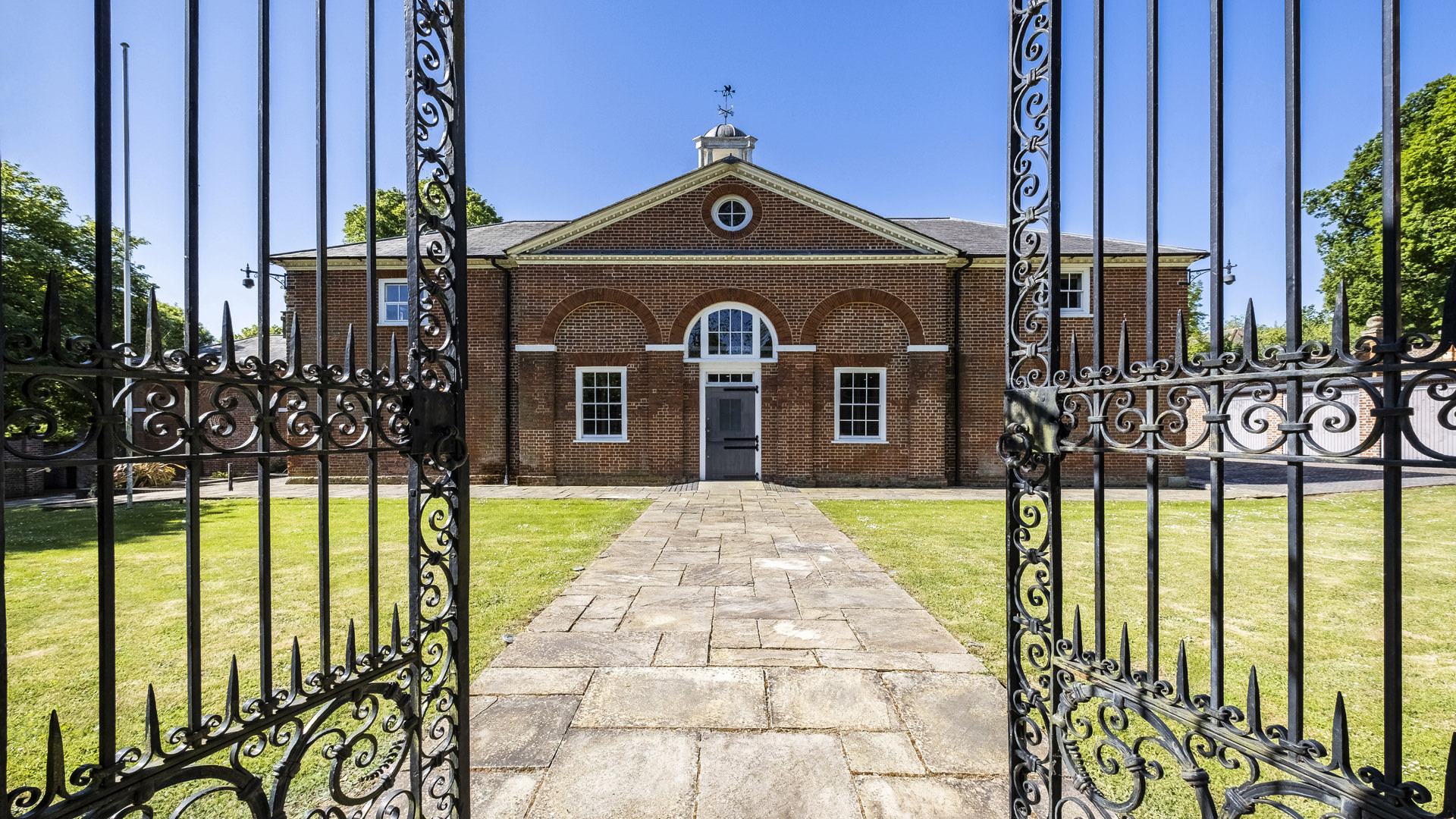 Foots Cray Mansion entrance with wrought-iron gates, perfect for outdoor events.