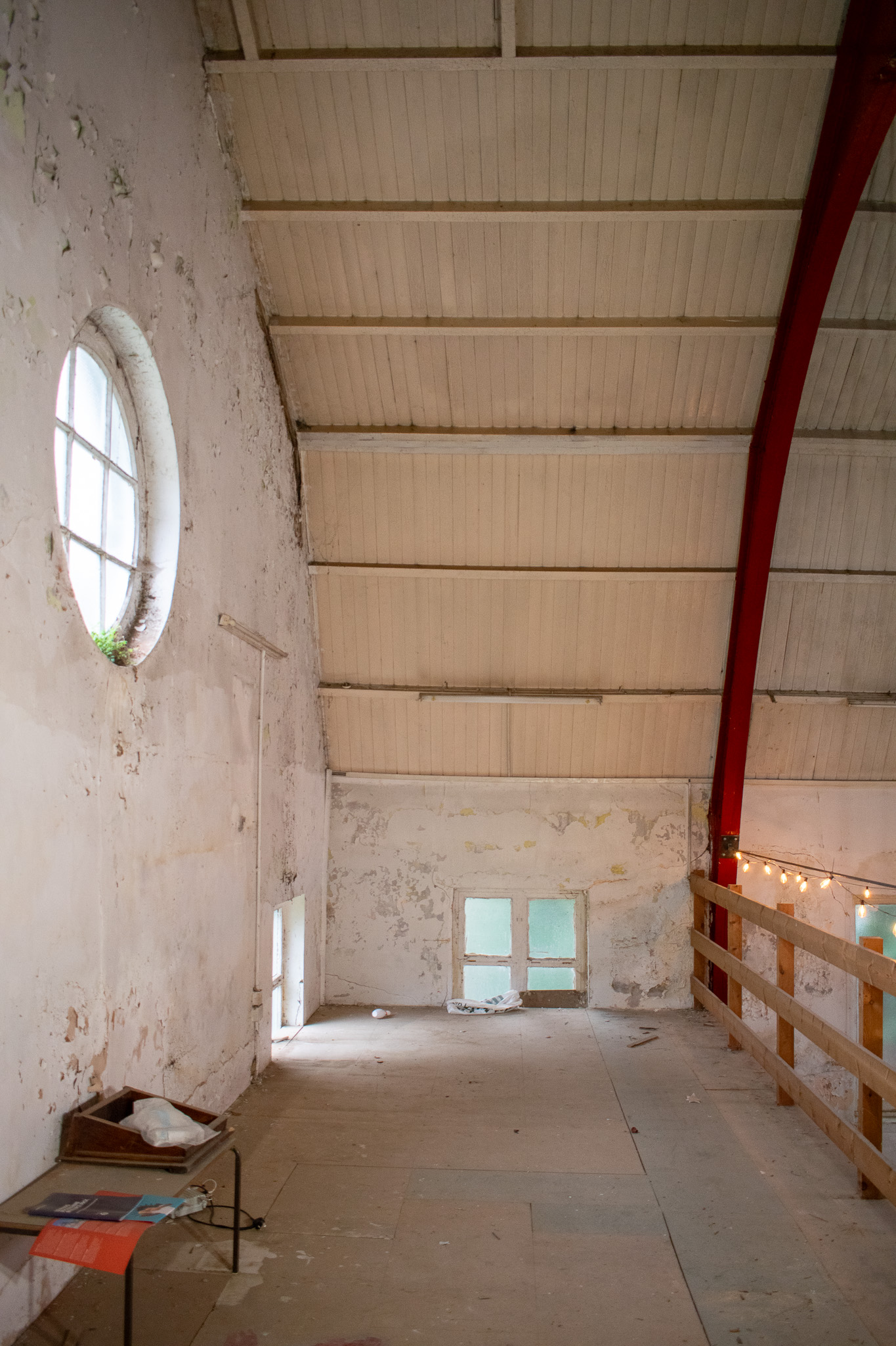 Rustic ARK Studios event space with high ceilings and natural light for creative gatherings.