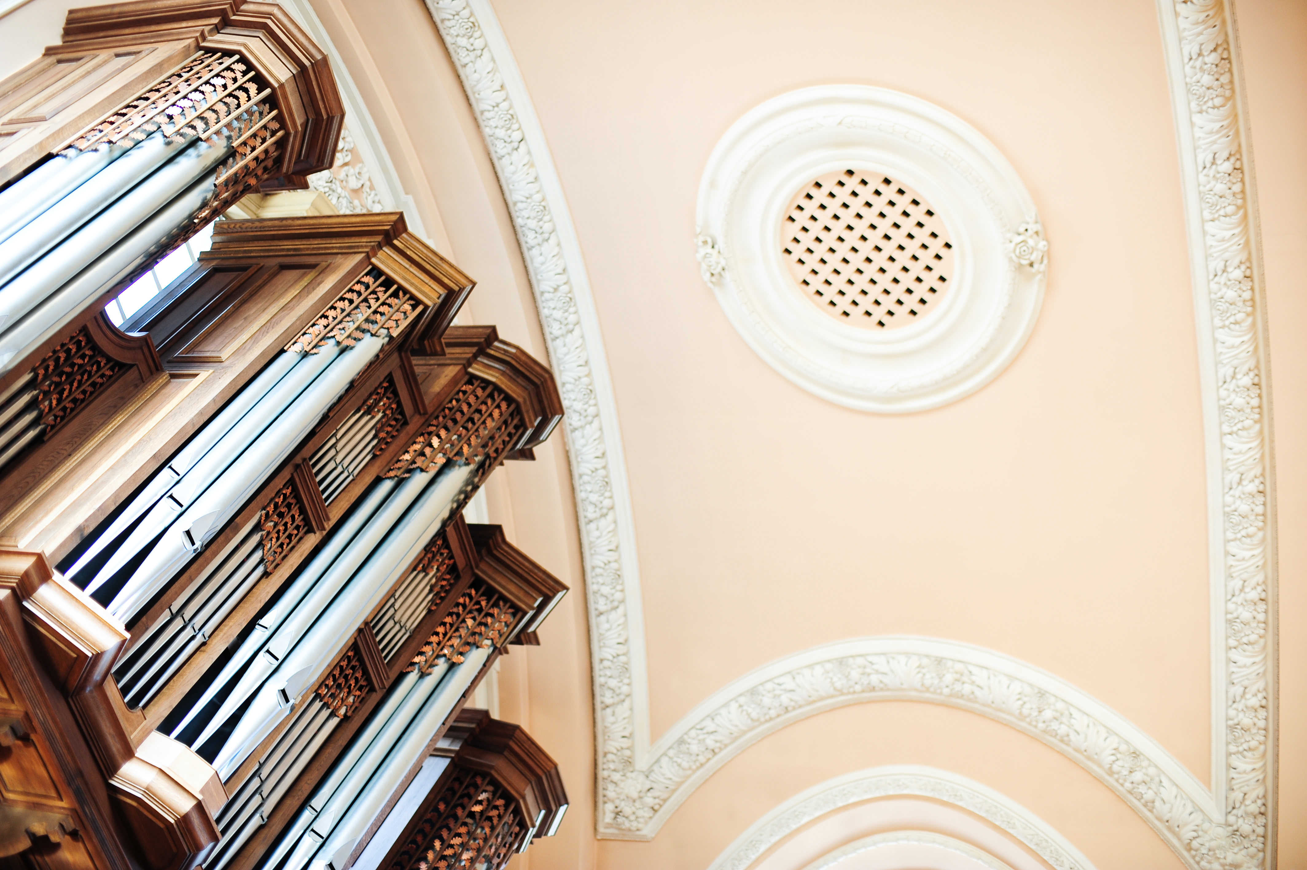 Great Hall at UCS Venues with intricate ceiling and organ, perfect for elegant events.