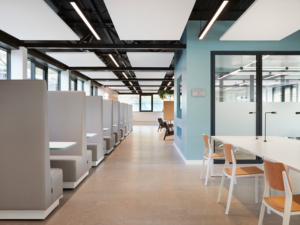 Modern workspace at UCS Venues with private booths for collaborative meetings and events.