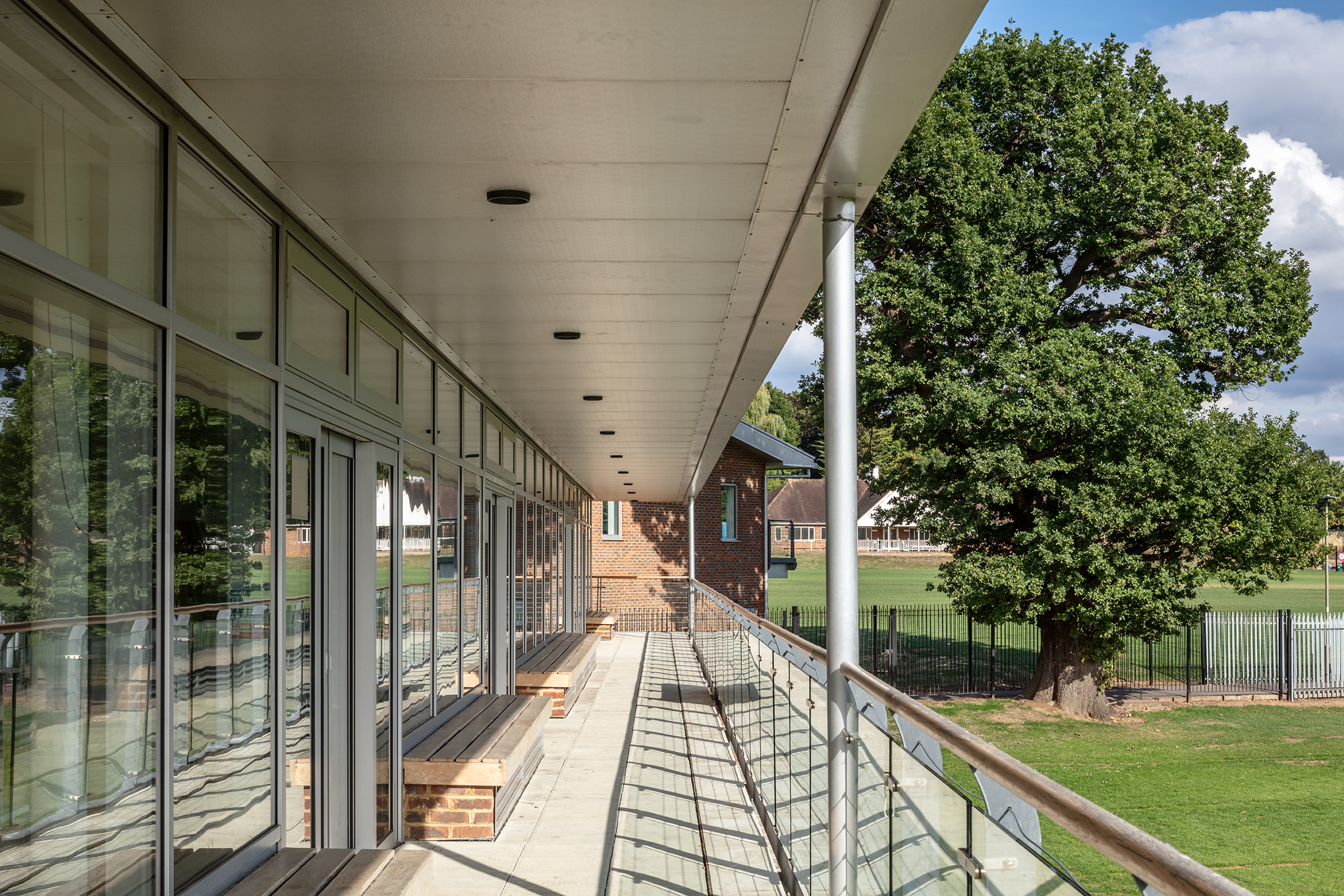 UCS New Pavilion corridor with large windows, ideal for networking events and meetings.