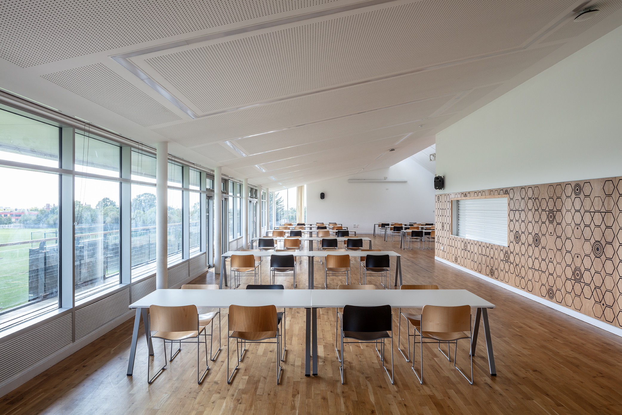 UCS New Pavilion event space with large windows, ideal for meetings and workshops.