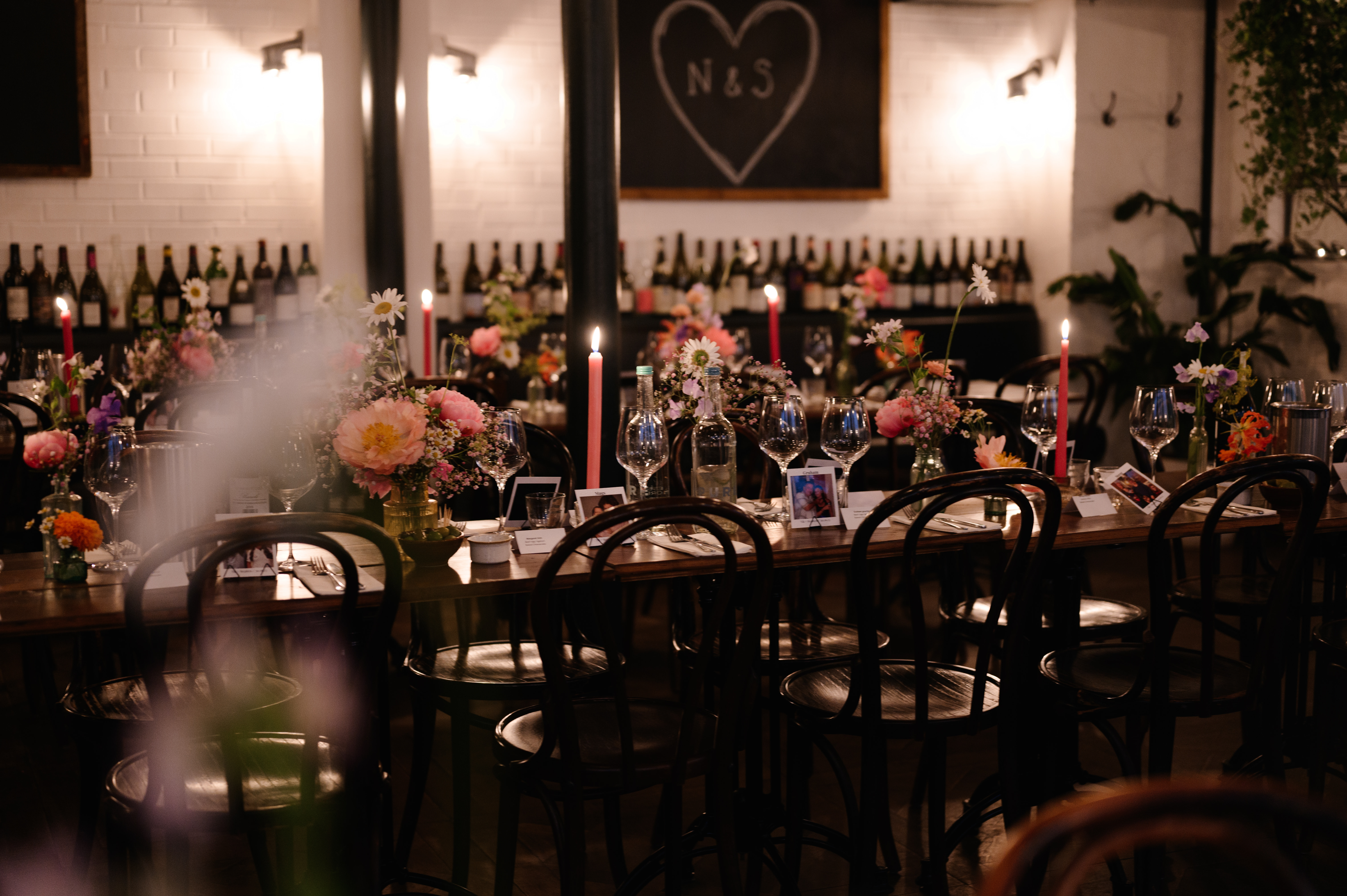 "Elegant event space with floral centerpieces at FARE Restaurant + Bar for intimate gatherings."