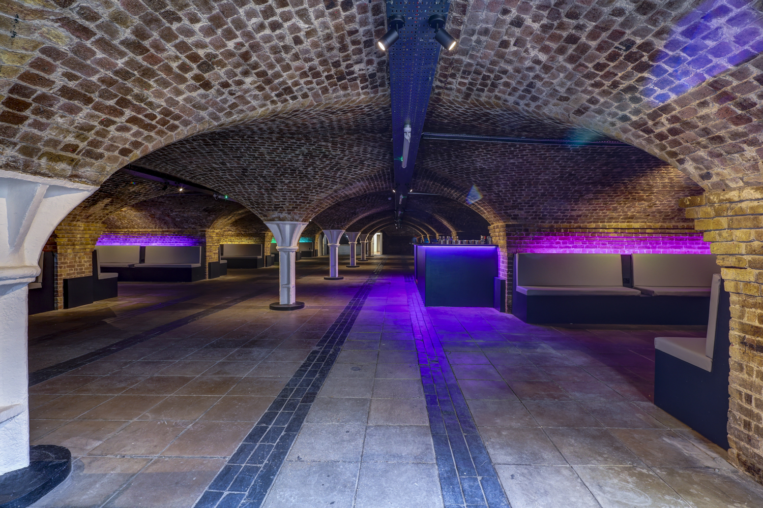 Half Venue in Dockside Vaults: exposed brick arches, ideal for unique events and gatherings.
