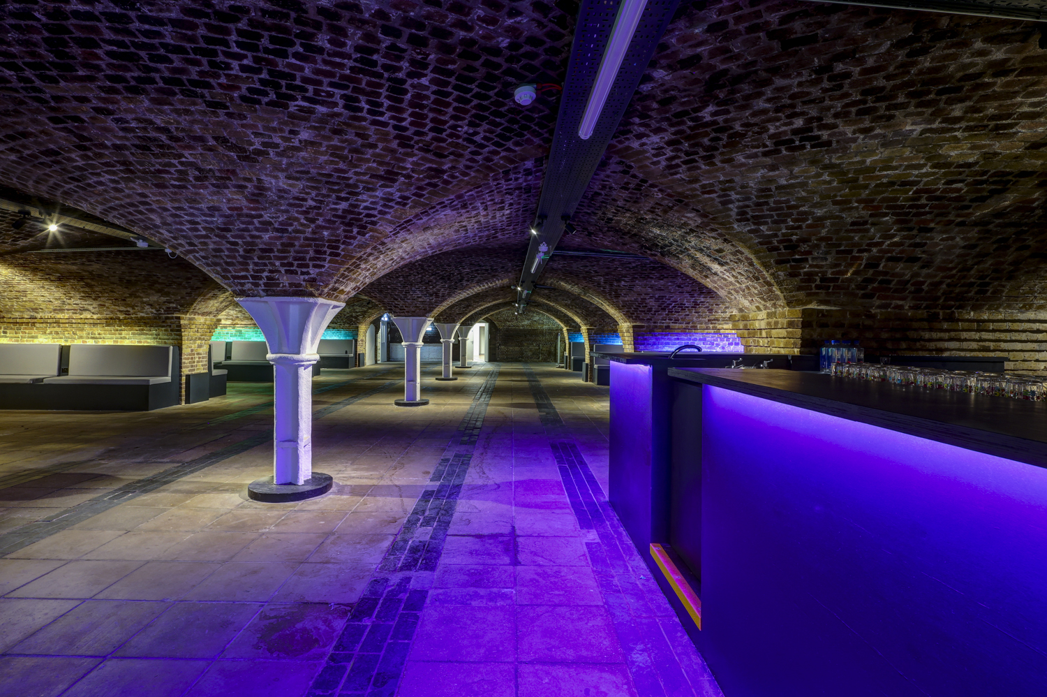 Spacious Dockside Vaults venue with exposed brick arches for events and parties.