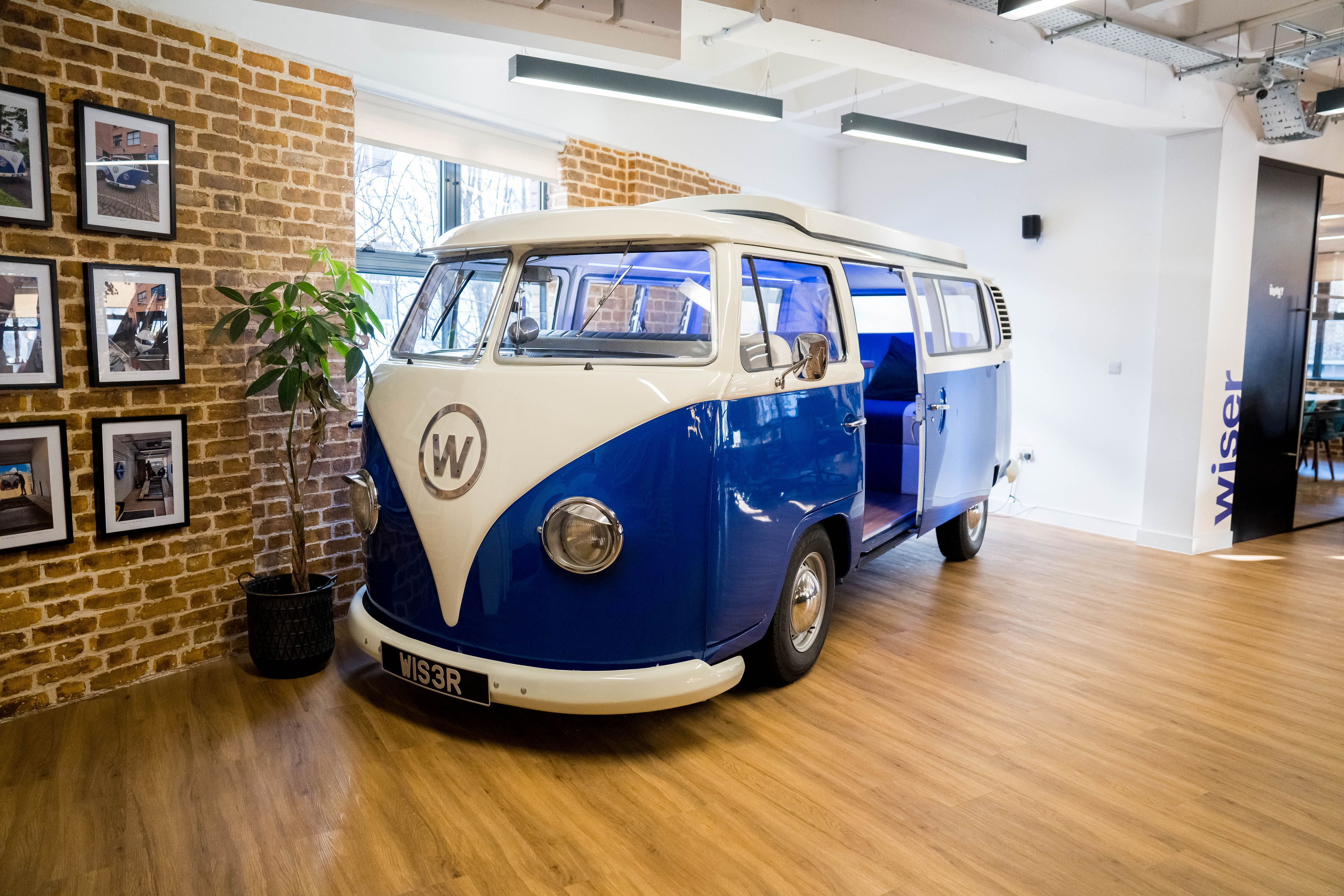 Vintage Volkswagen van in modern EC1 Campus event space, perfect for gatherings.