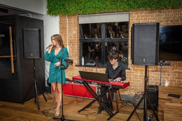 Live music performance at EC1 Campus with stylish decor for networking events.