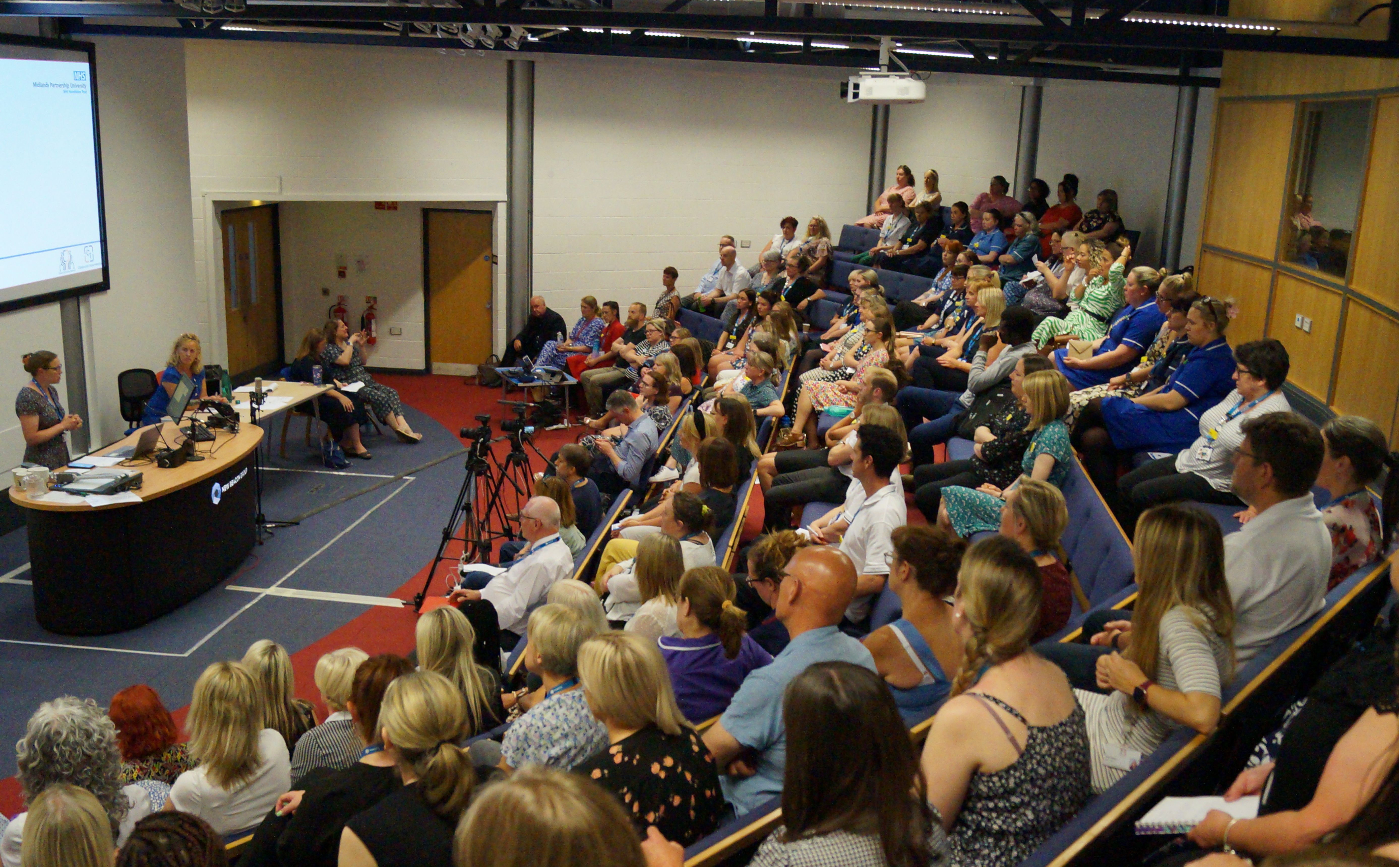 Conference Hall at Beaconside Centre with tiered seating for engaging seminars.