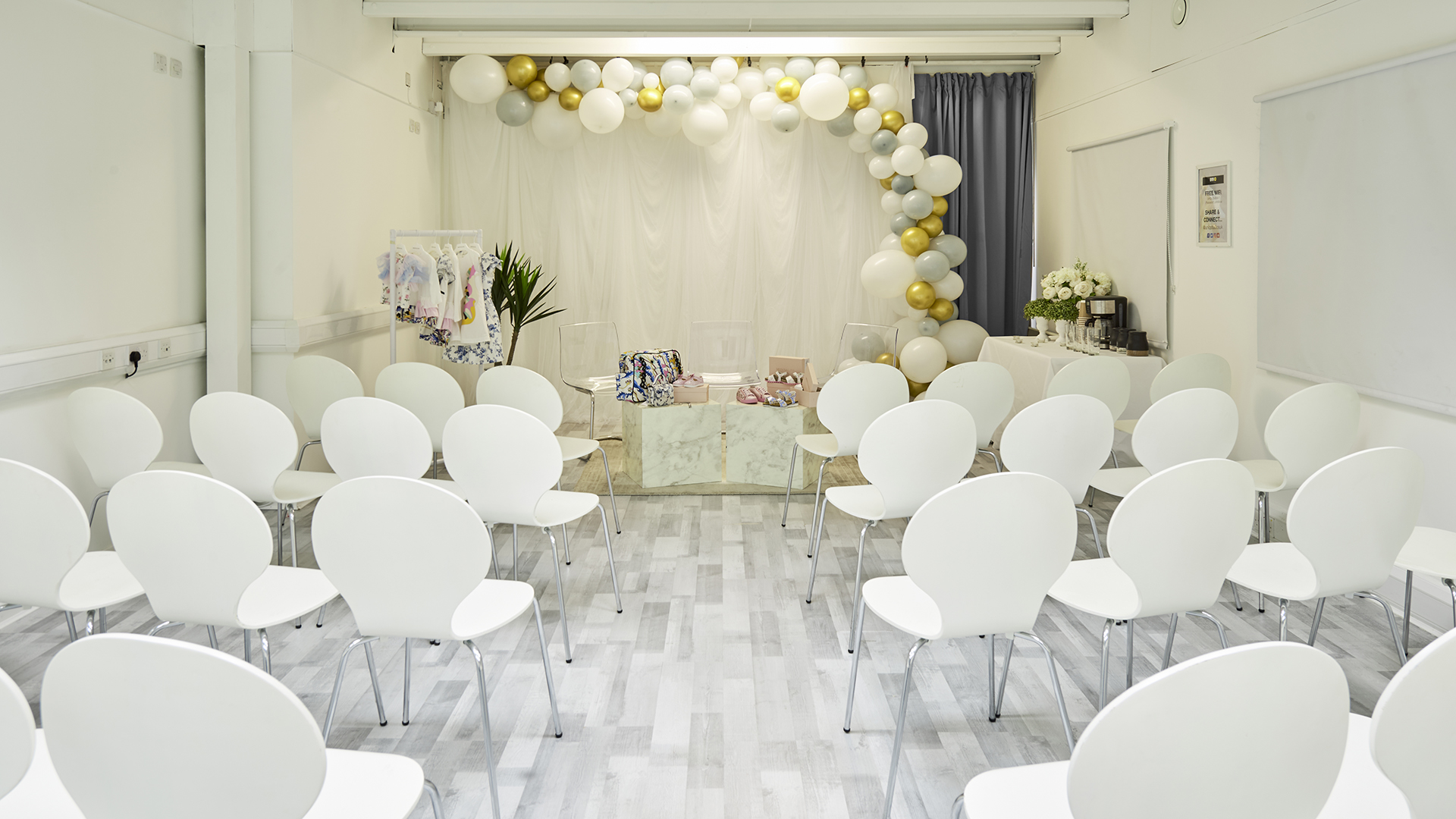 S3 Royal Arsenal event space with elegant balloon arch and modern seating setup.