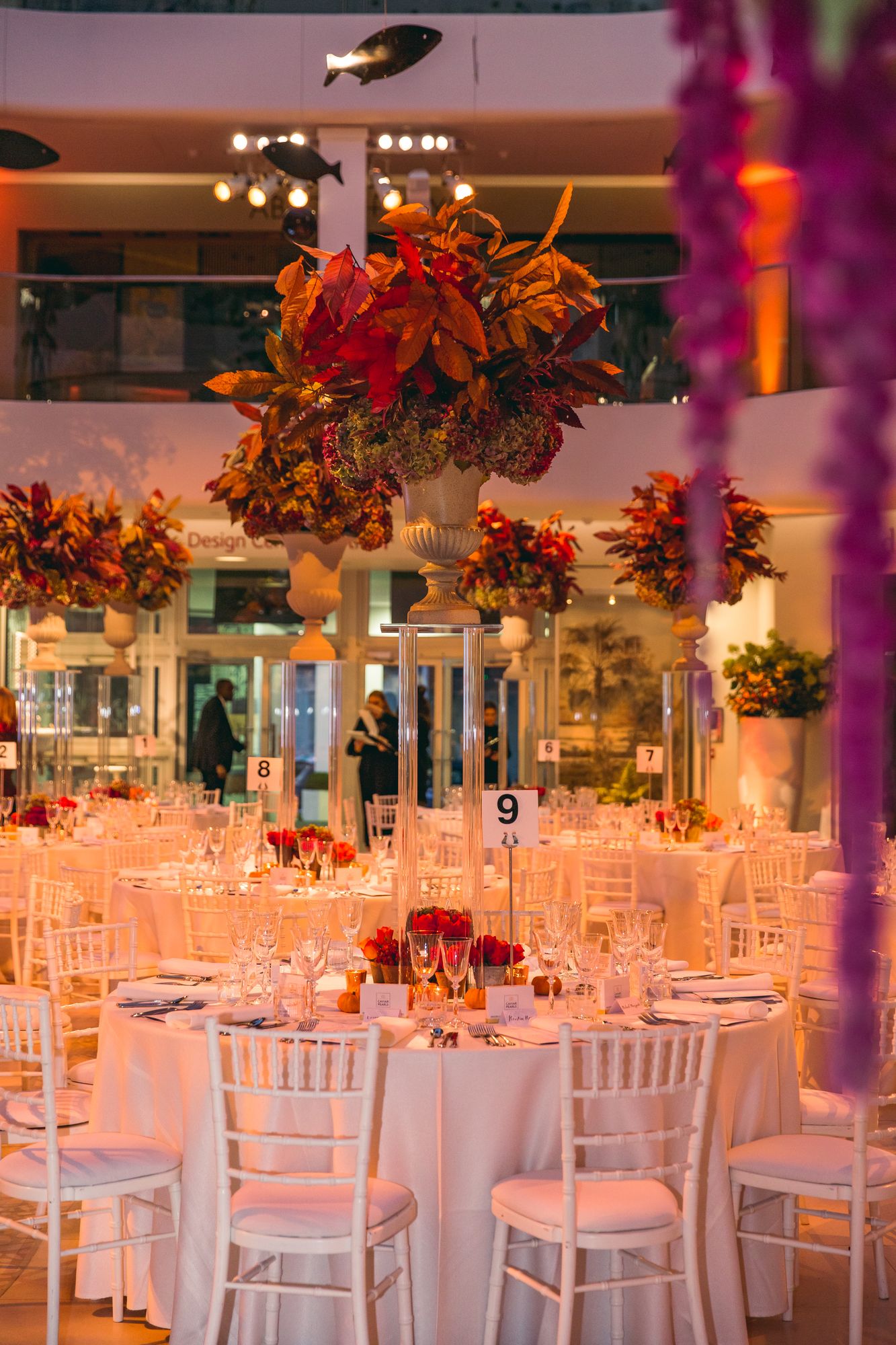 Elegant event space at Design Avenue, Chelsea Harbour with floral centerpieces and warm lighting.