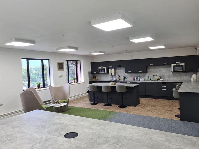 Modern meeting room with sleek cabinetry, ideal for networking events and gatherings.