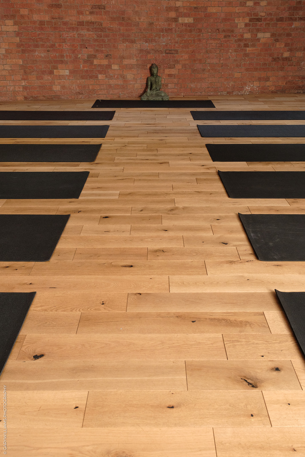 Serenity Studio London with black yoga mats, ideal for wellness retreats and mindfulness workshops.