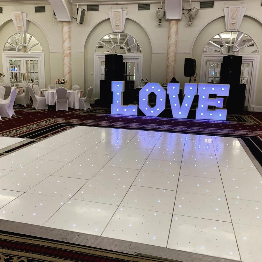 Emperor Suite with illuminated "LOVE" display, perfect for weddings and romantic events.