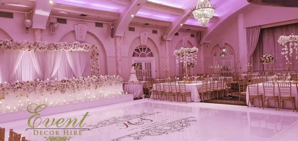 Elegant Emperor Suite with pink lighting, perfect for weddings and galas.