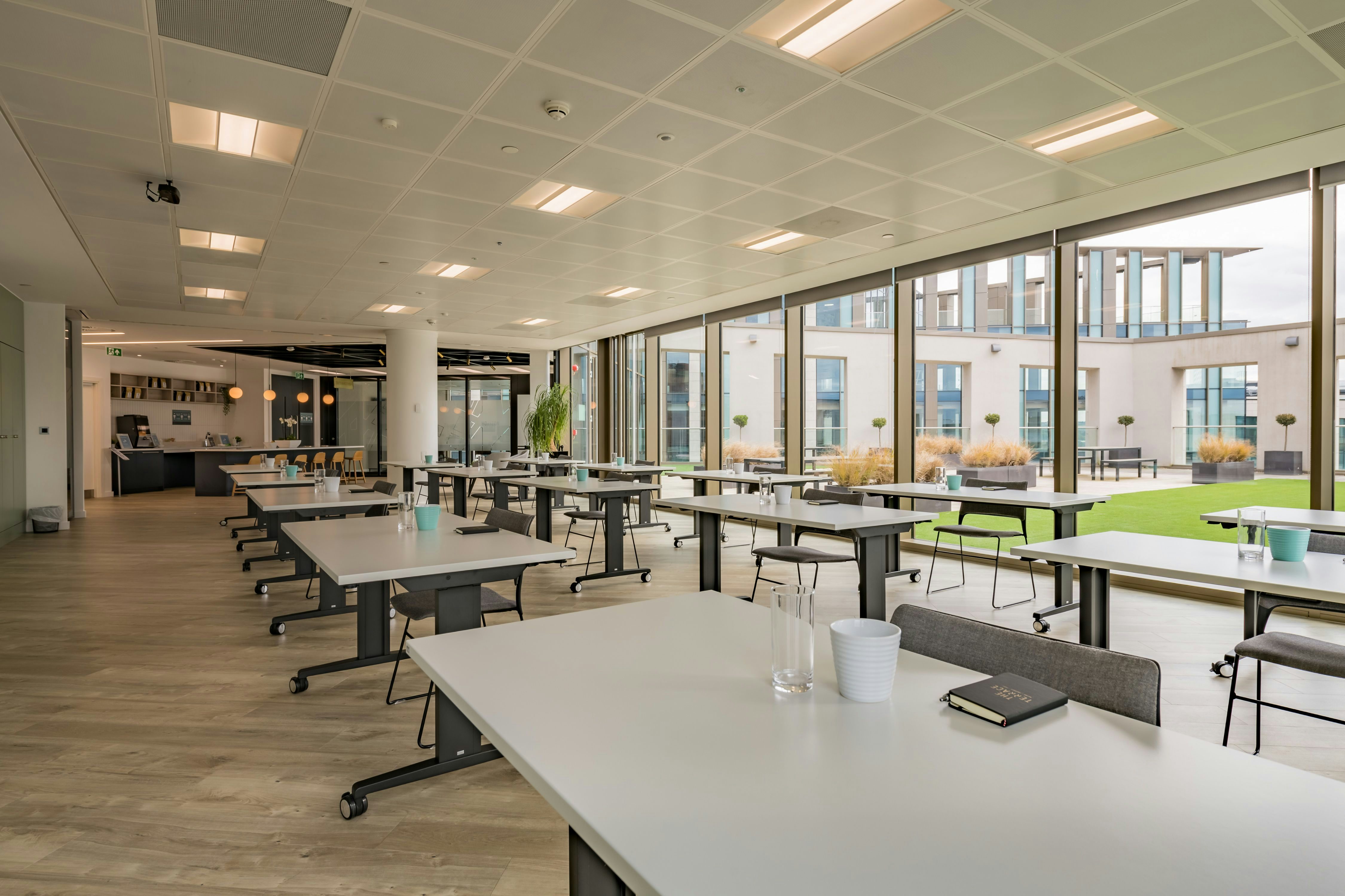 Modern meeting space with large windows, ideal for workshops and brainstorming sessions.