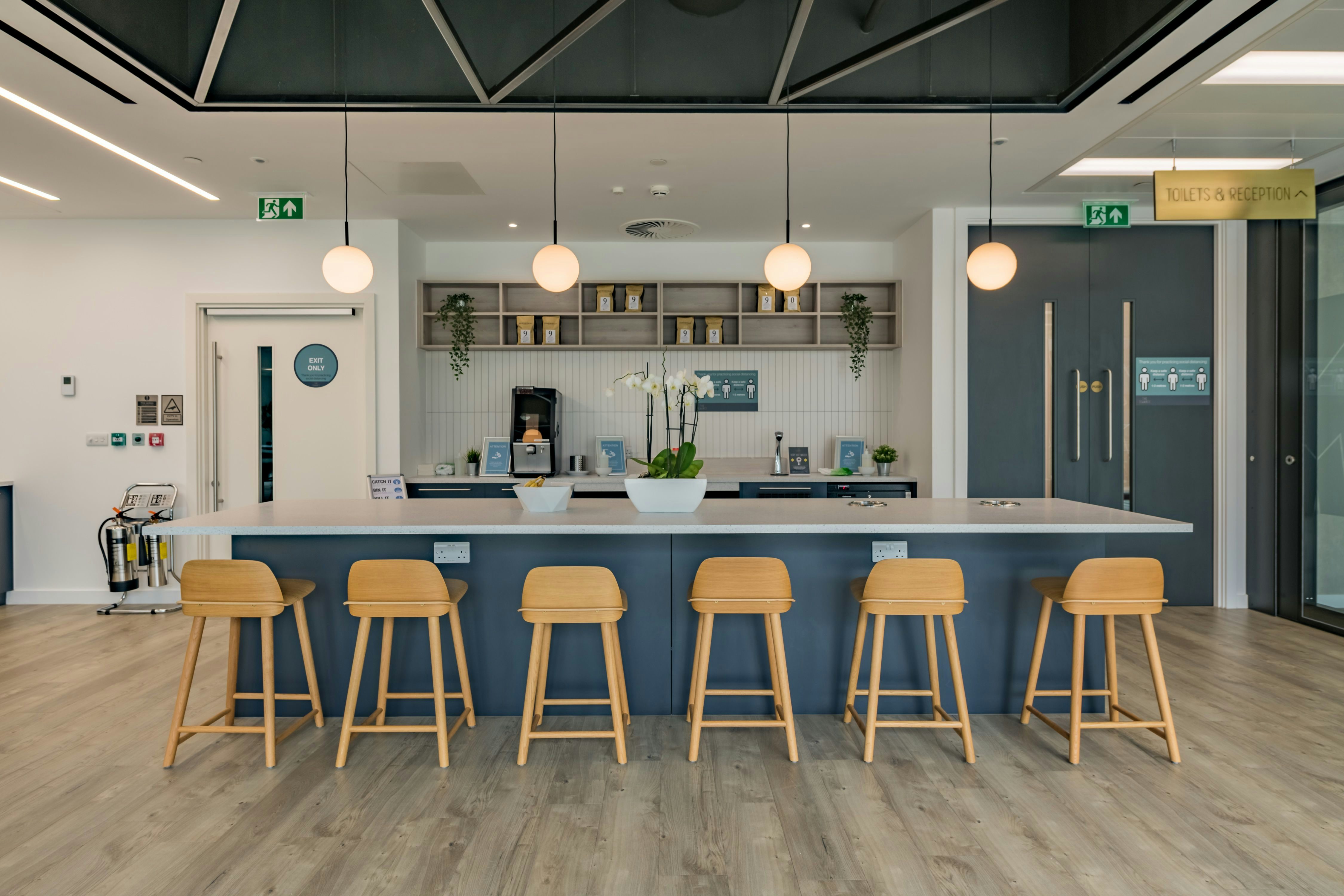 Modern refreshment area with sleek bar for networking events and informal meetings.