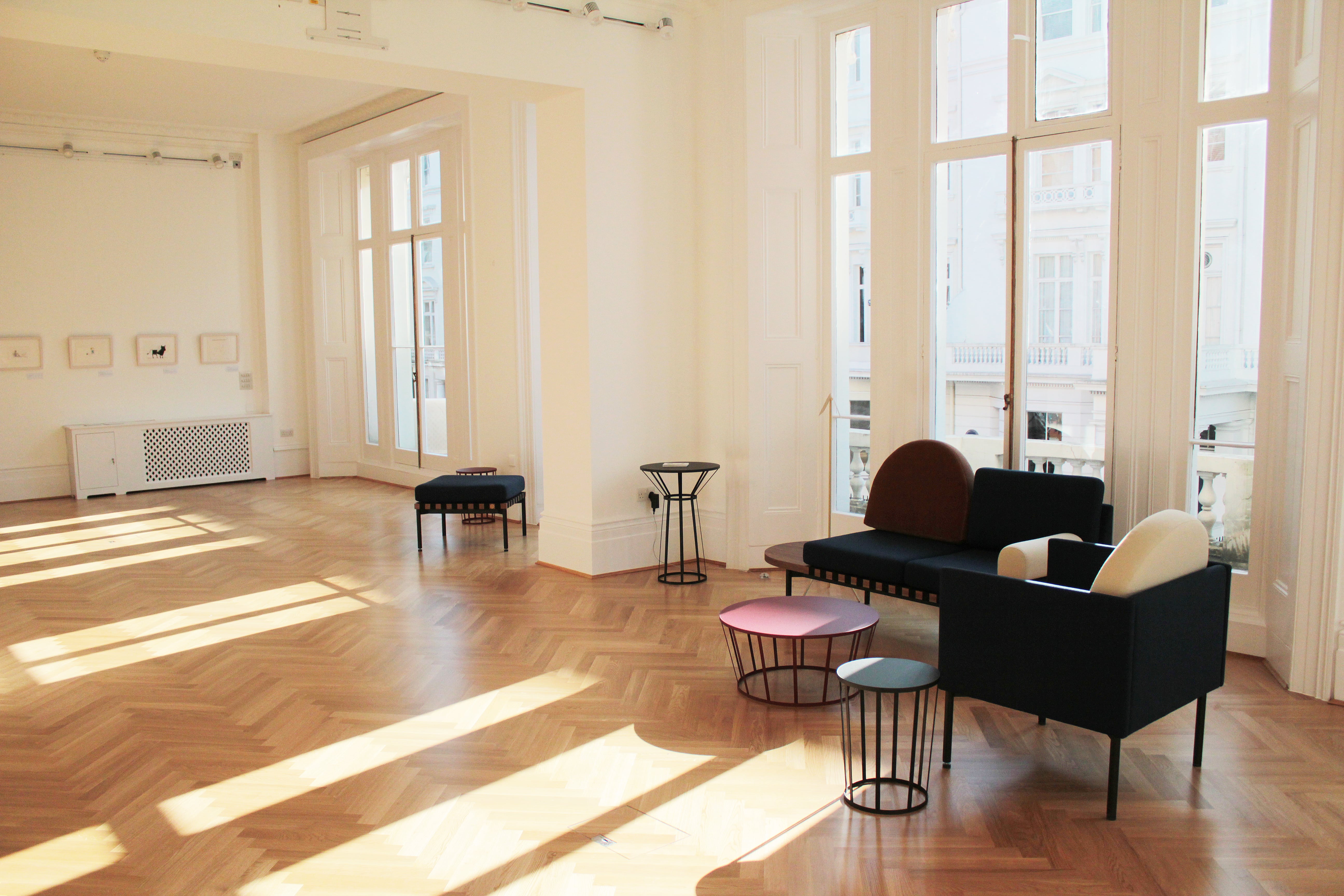 Bright event space at Institut français, featuring large windows and elegant wooden flooring.