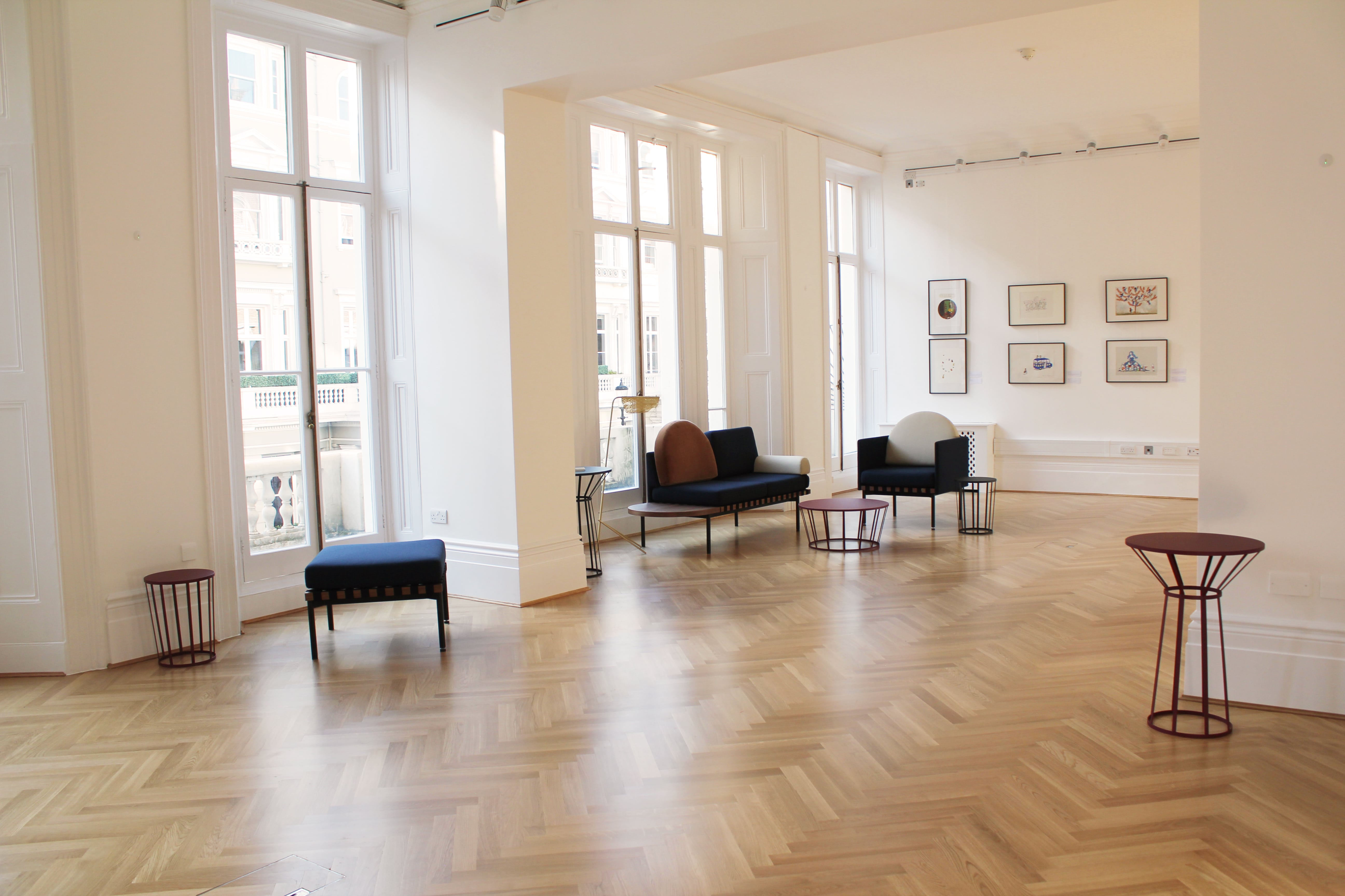 Elegant event space with hardwood floors, ideal for networking and gatherings.