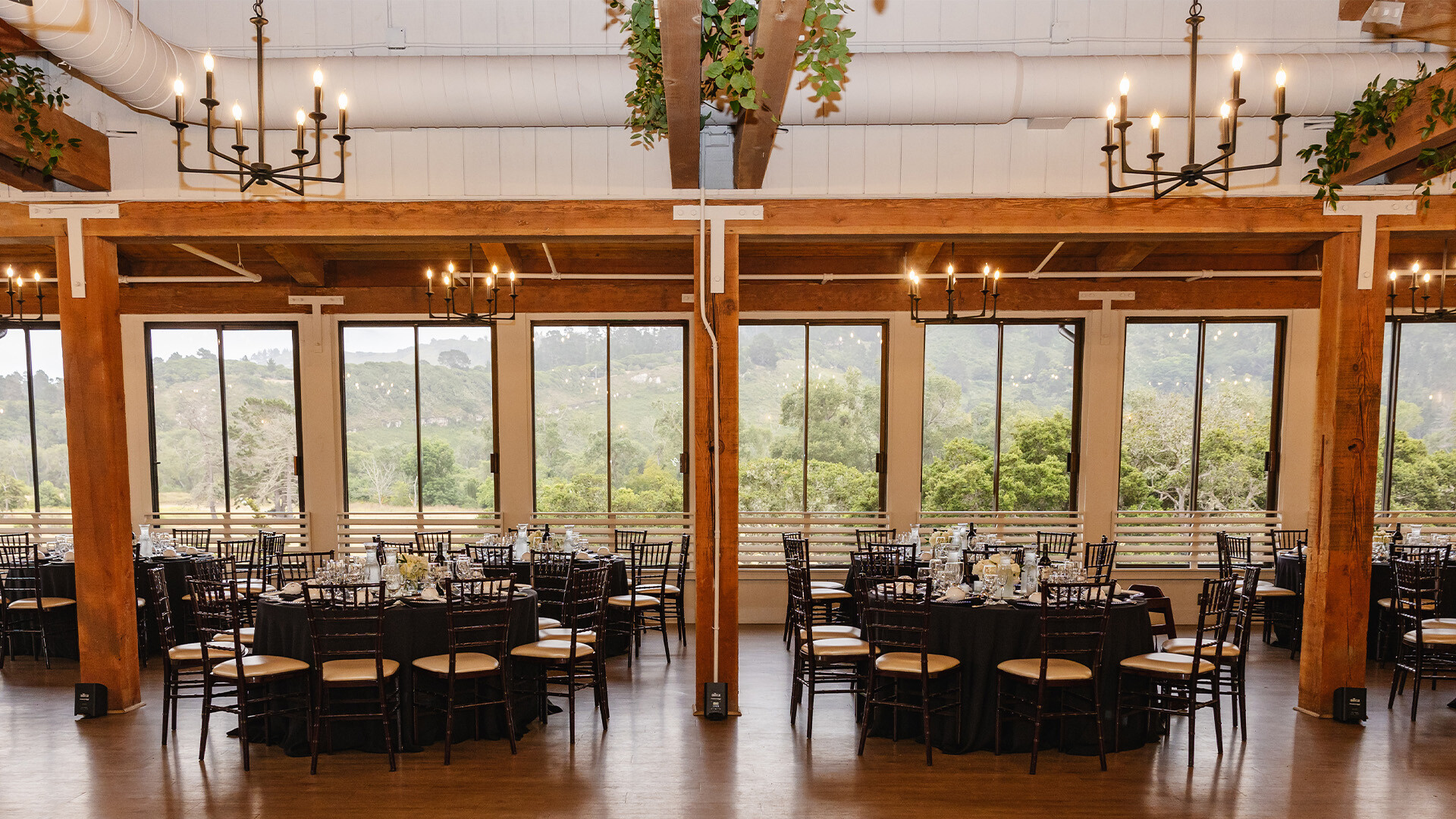 Casa De Salinas industrial-chic event space with wooden beams for wedding receptions and galas.