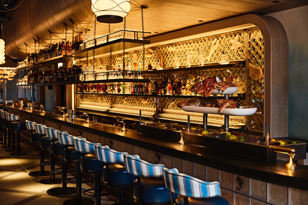 Stylish Azzurra Bar terrace with inviting seating, perfect for networking events and gatherings.