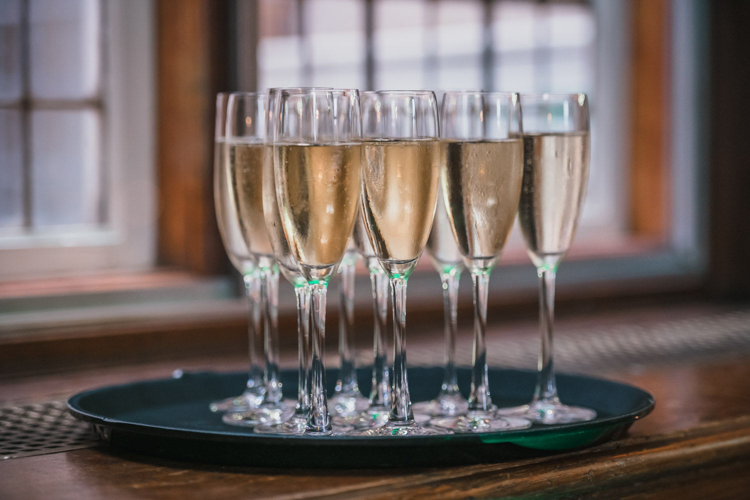 Champagne flutes on a tray for summer parties at Church House, Westminster celebrations.