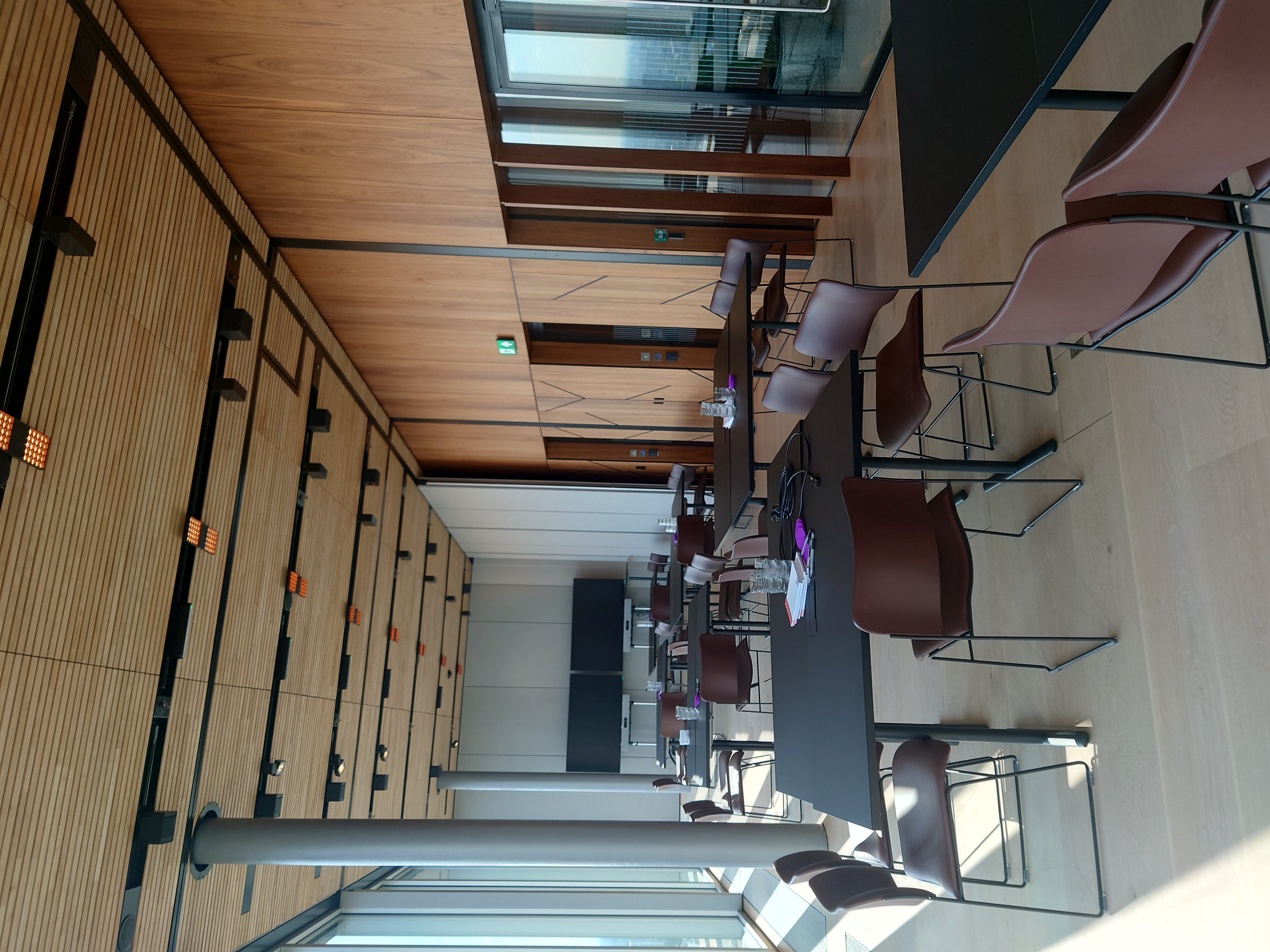 Modern meeting space at The Executive Suites, large windows, ideal for networking events.