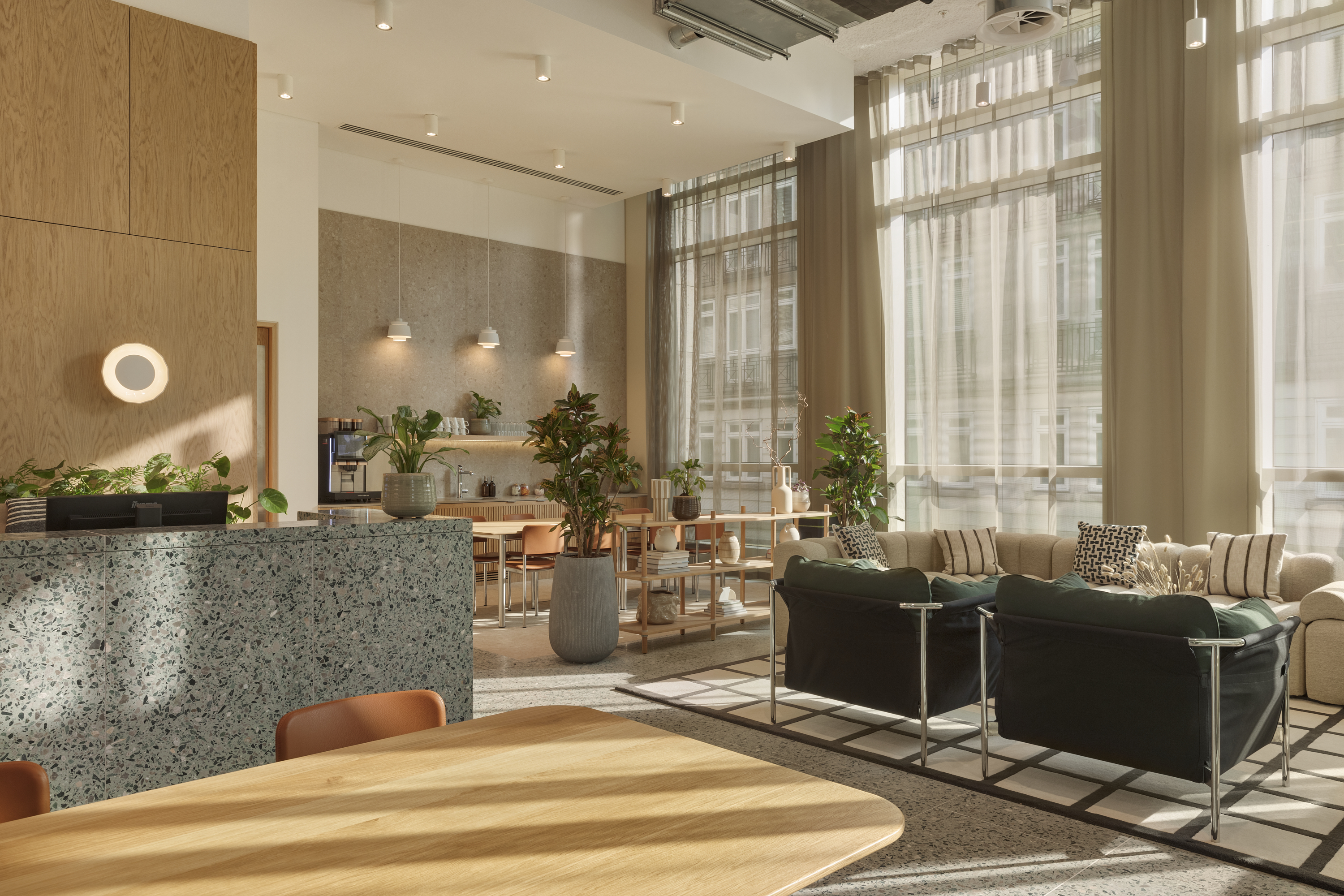 Modern meeting space with large windows, ideal for networking and brainstorming events.