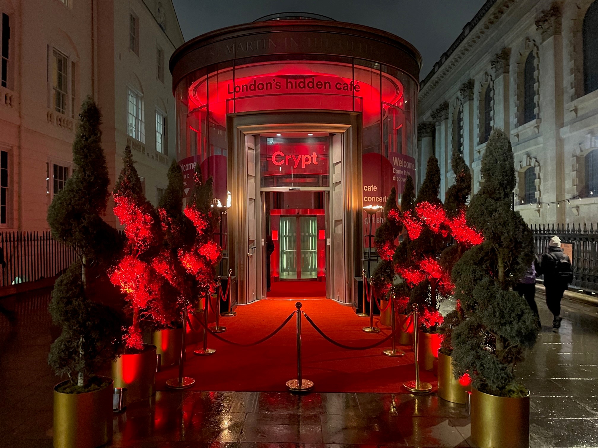 Illuminated venue entrance with red carpet at St Martin-in-the-Fields for upscale events.