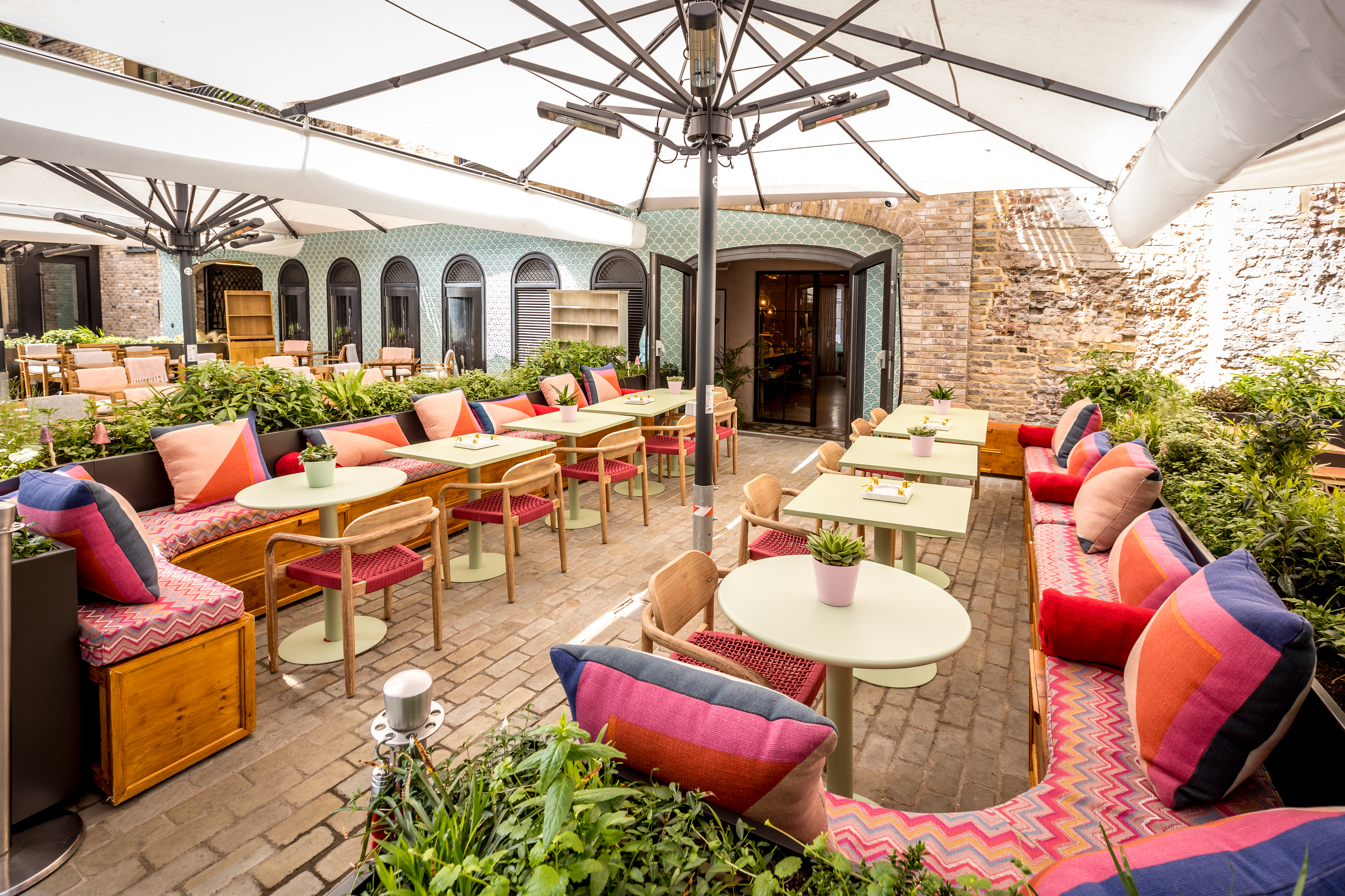 Vibrant outdoor event space at The Little Scarlet Door, perfect for casual gatherings.