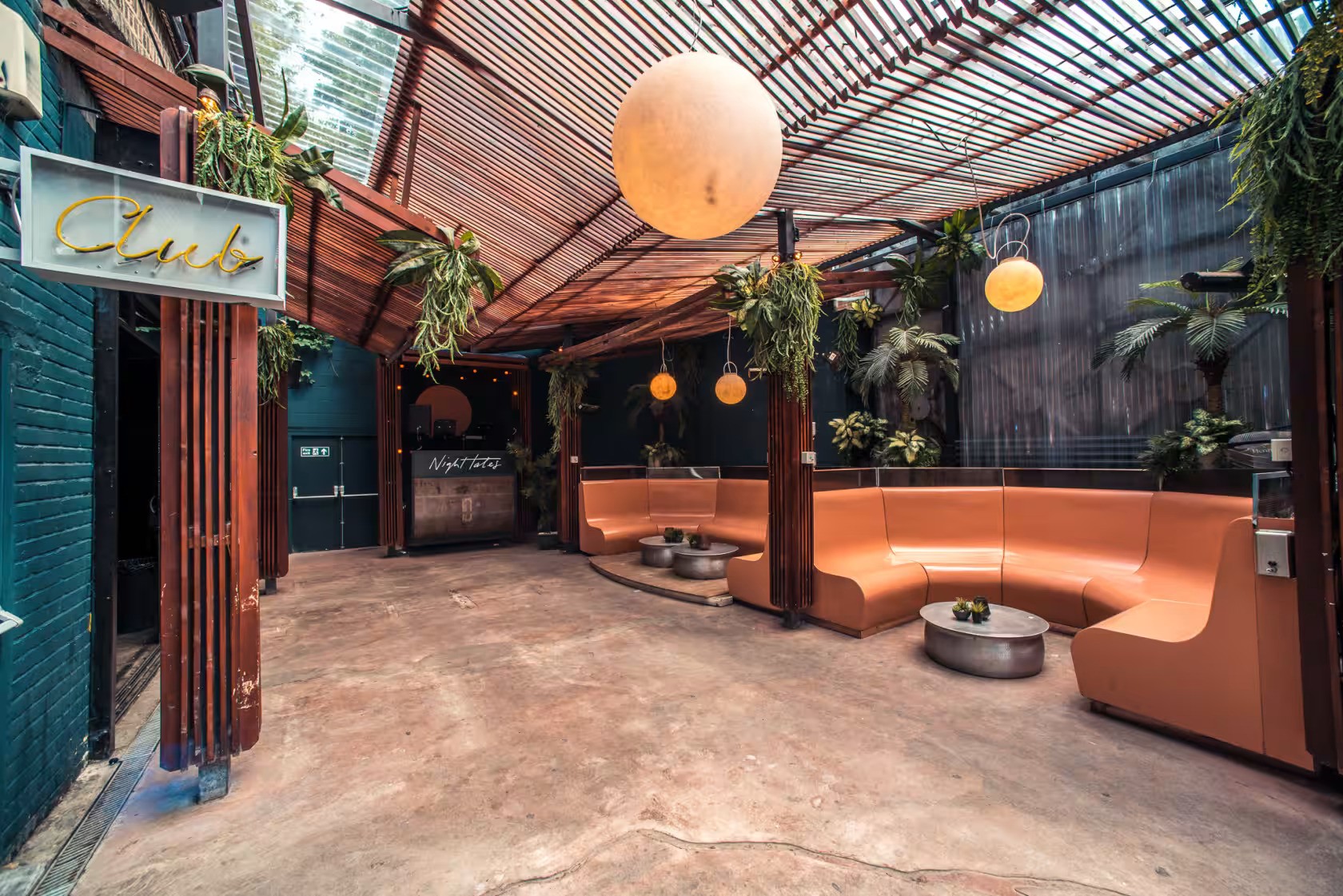 Stylish modern event space with curved seating, ideal for intimate gatherings and networking.