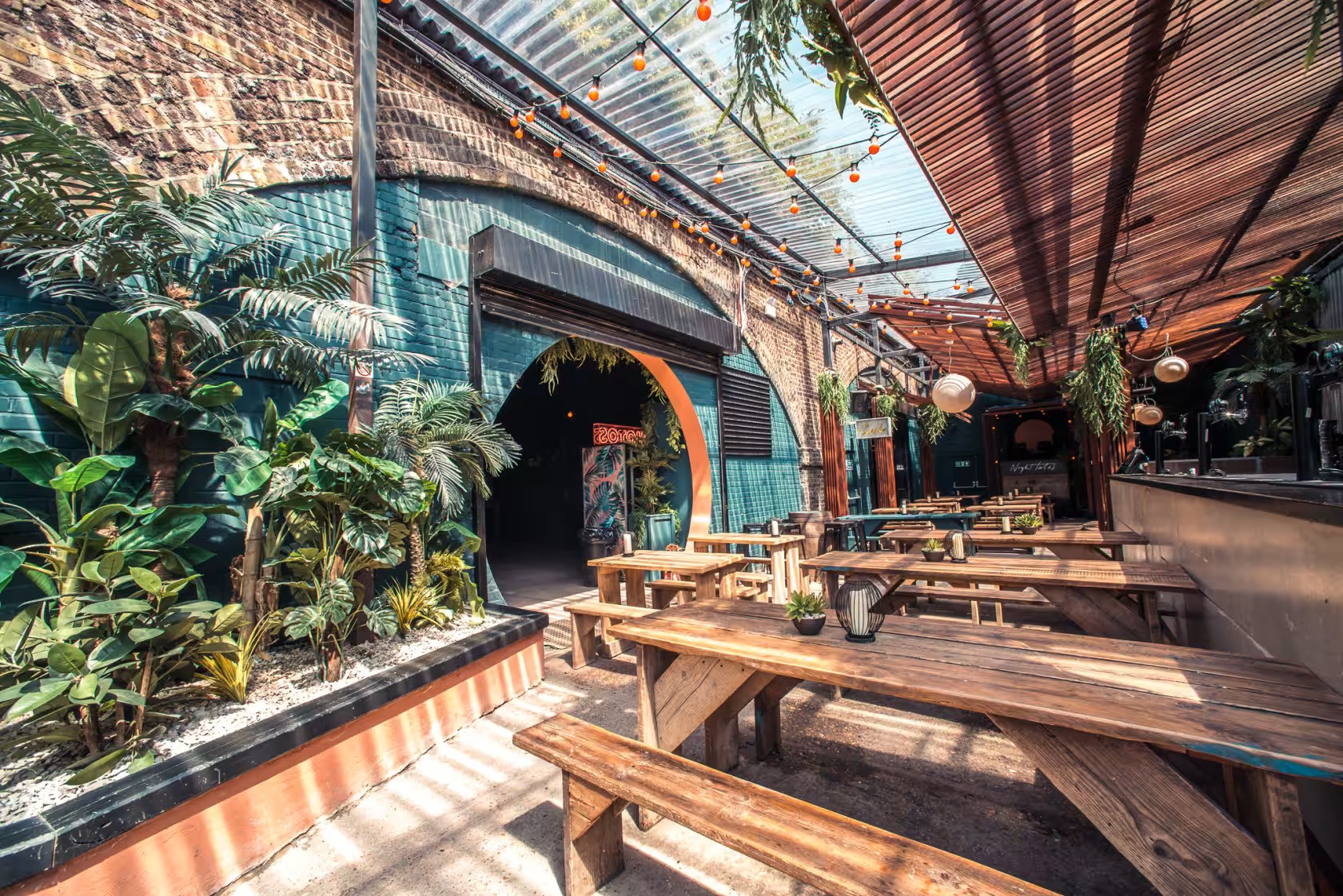 Vibrant outdoor venue with lush greenery for casual meetings and events.