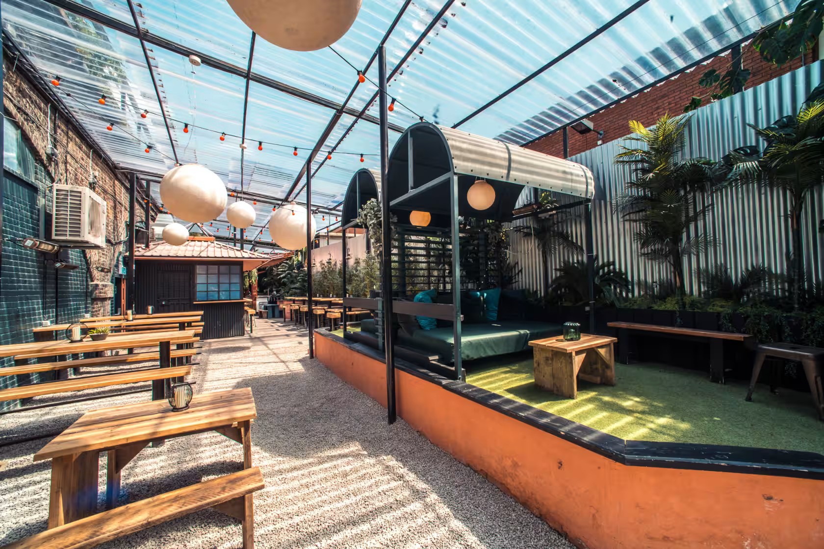 Vibrant outdoor event space with lush greenery for casual gatherings and networking.