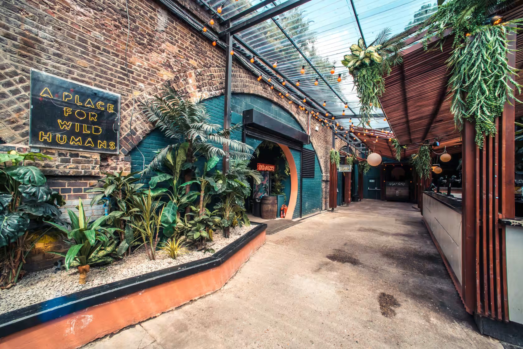 Vibrant garden venue with lush greenery for creative events and gatherings.