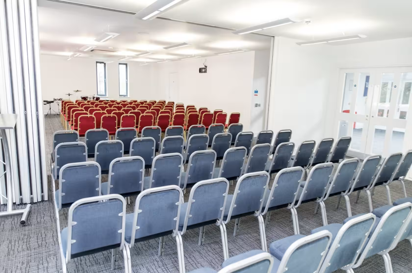 Ruby Suite meeting space with rows of chairs, ideal for presentations and workshops.