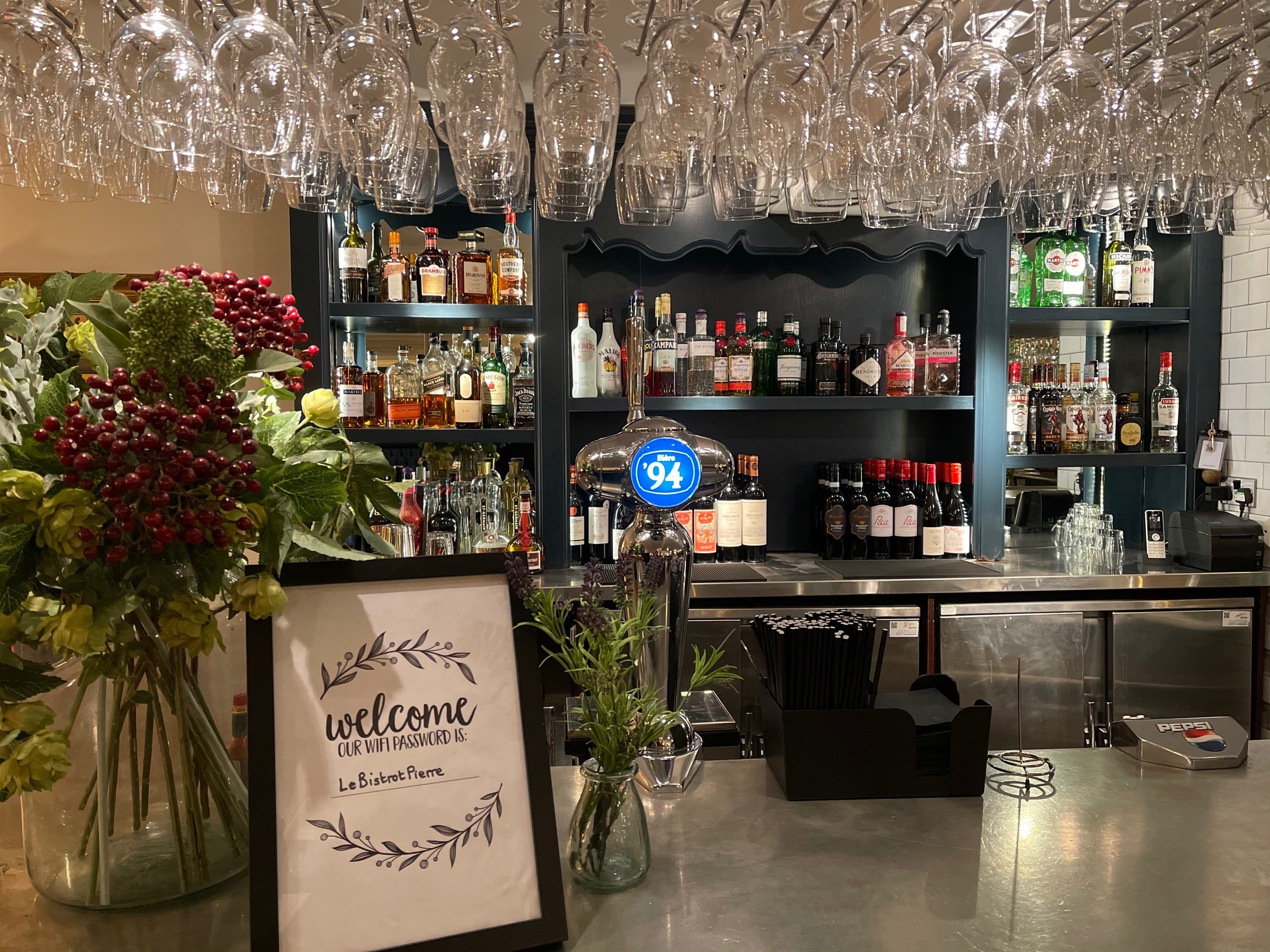 Clopton Room bar at Bistrot Pierre, elegant spirits display for events and gatherings.