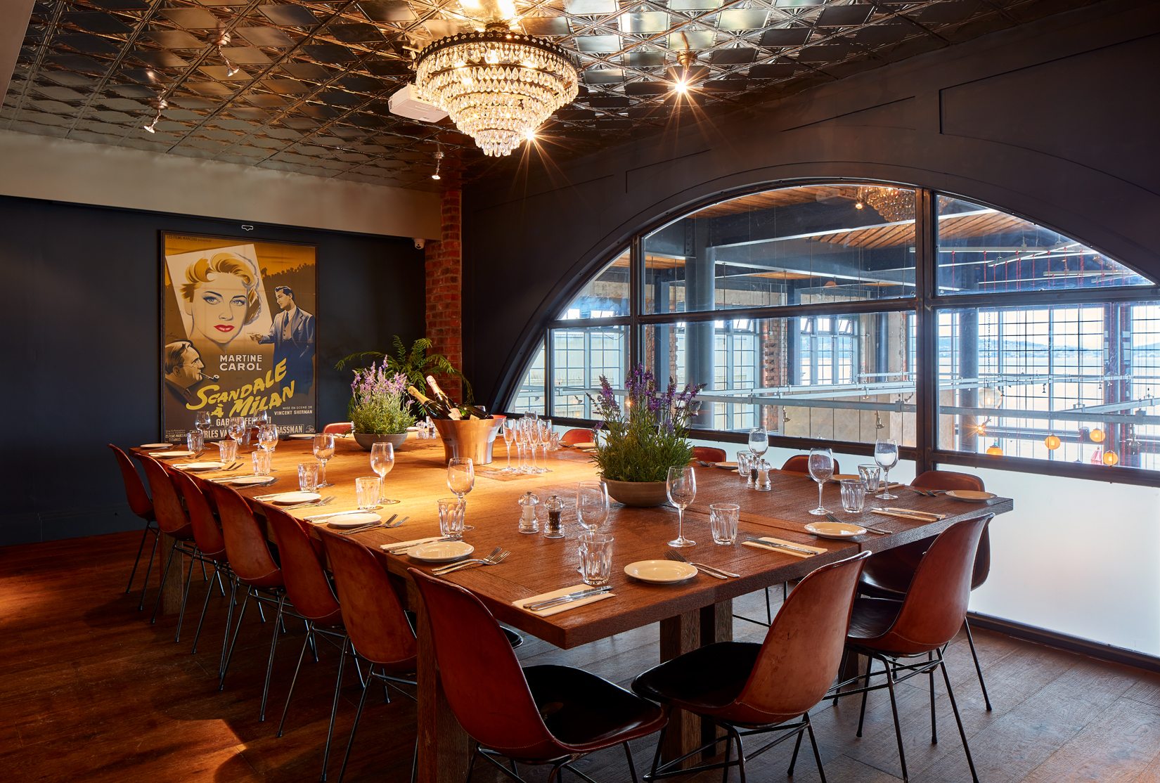 Stylish meeting room with wooden table, ideal for corporate and social events.