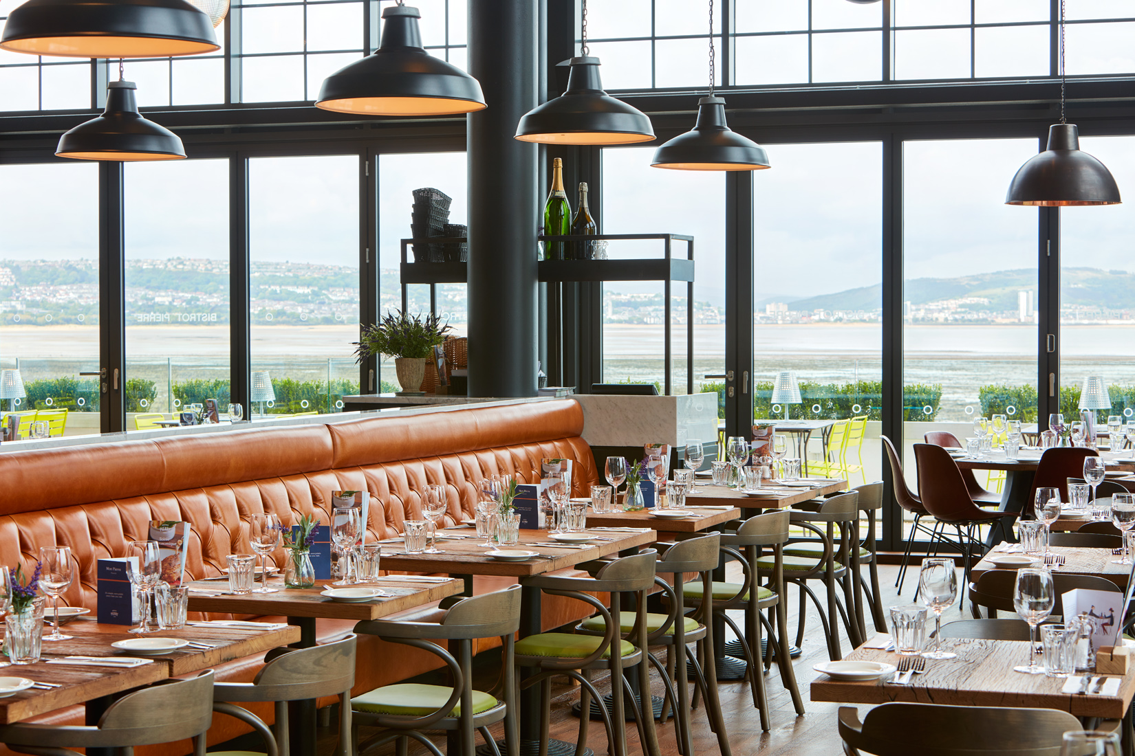 Tivoli Room at Bistrot Pierre Mumbles, modern venue with leather seating for events.