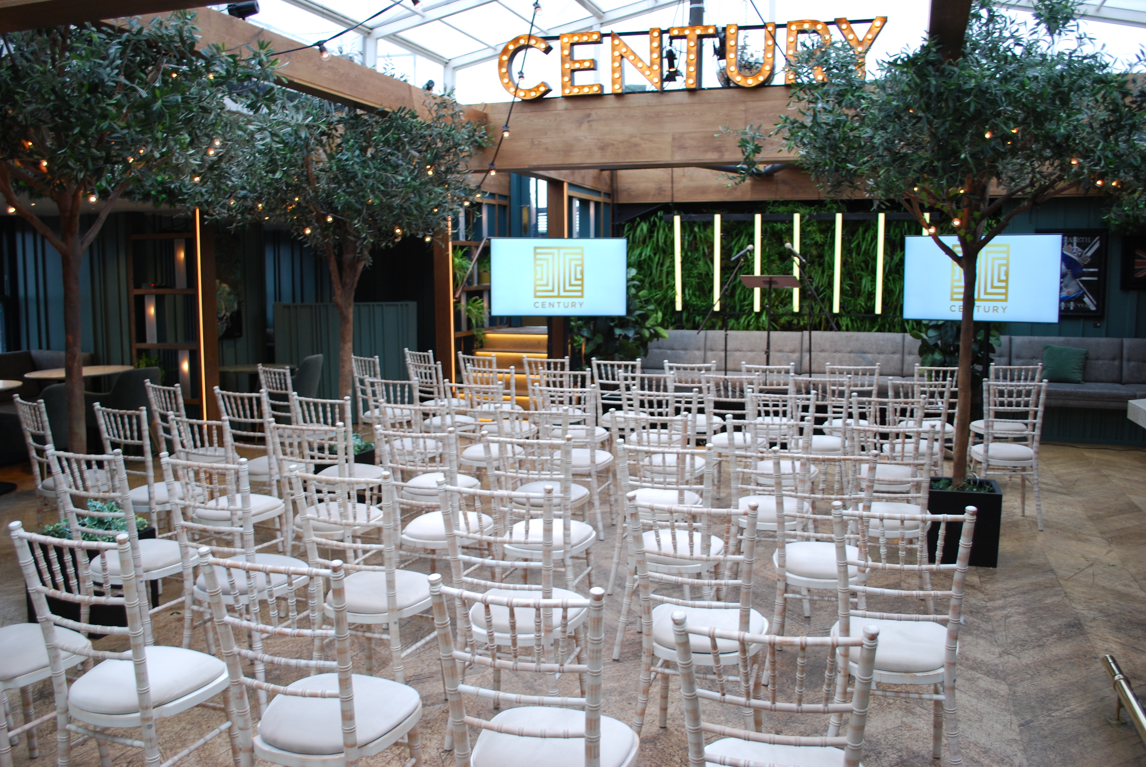 Roof Terrace with retractable glass roof, elegant chairs for corporate meetings and events.
