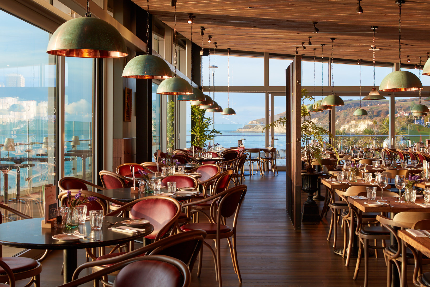 Elegant Bistrot Pierre restaurant in Eastbourne with scenic water views, perfect for events.