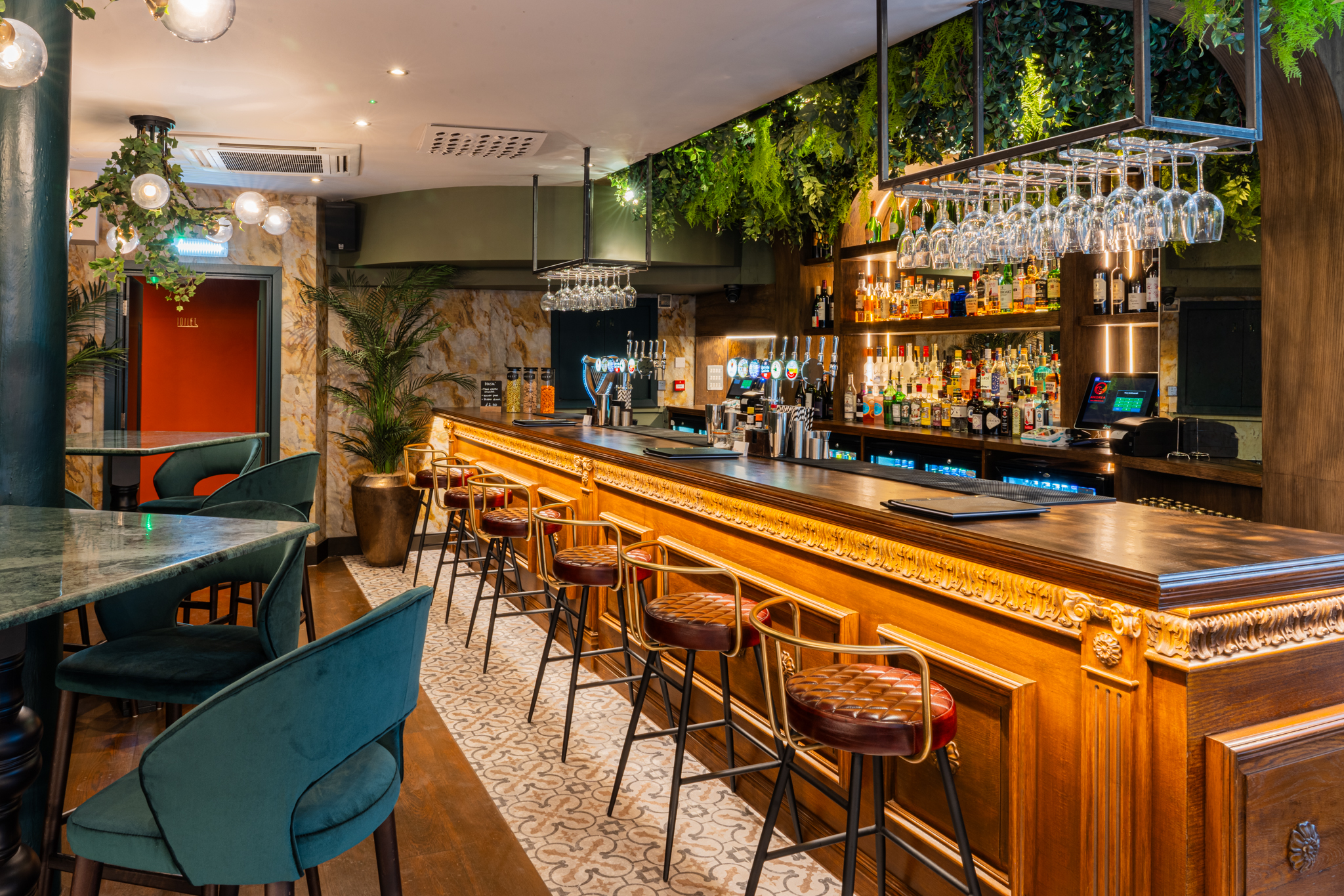 Stylish bar area with warm wood accents for networking events and cocktail receptions.