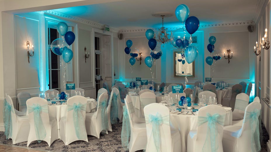 Elegant event space at Dyrham Park with blue decor, perfect for weddings and corporate events.