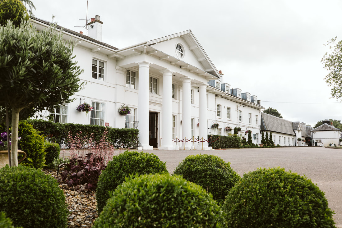 Dyrham Park Country Club: Elegant venue with classic columns for corporate retreats and events.