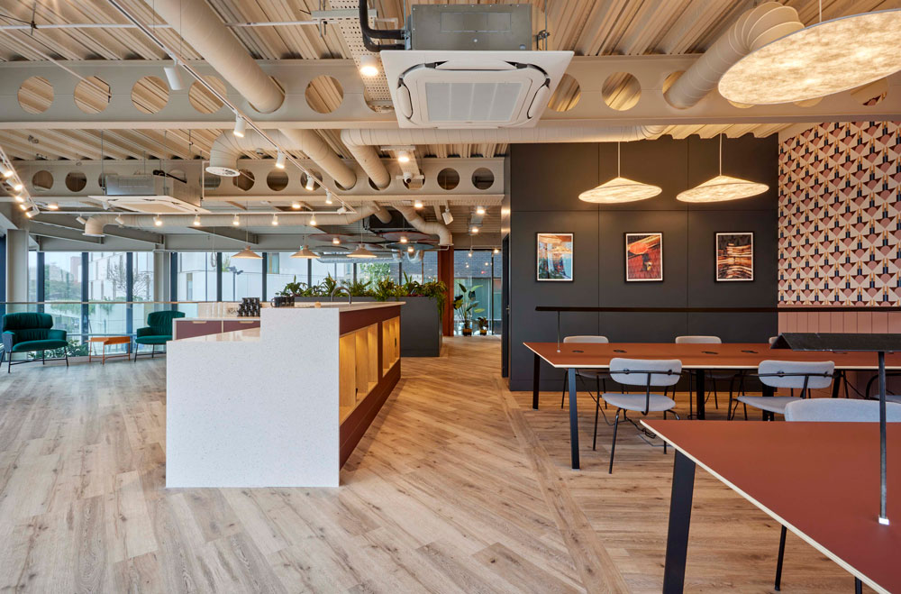 Modern meeting room with pendant lighting, ideal for networking events and small meetings.