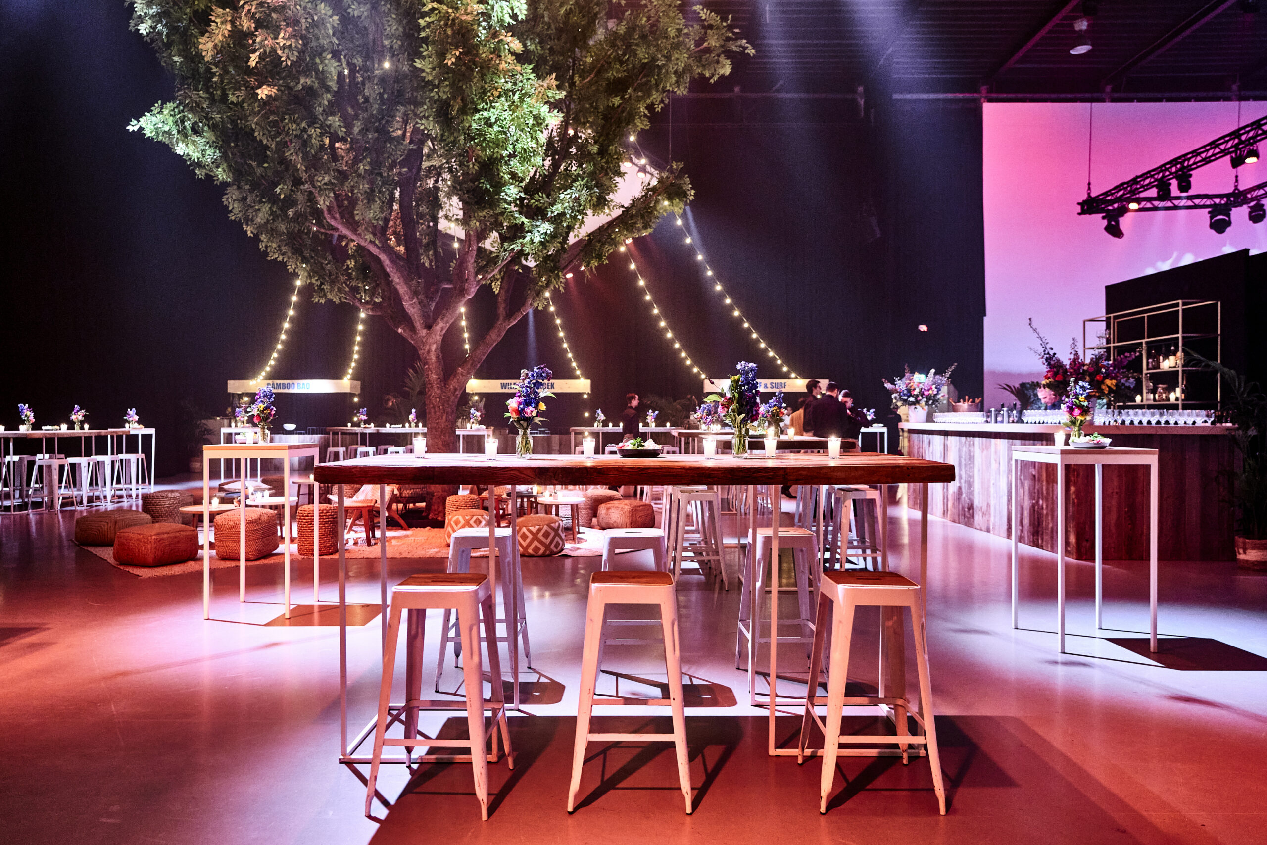 Event Lounge venue with large artificial tree, perfect for corporate events and celebrations.